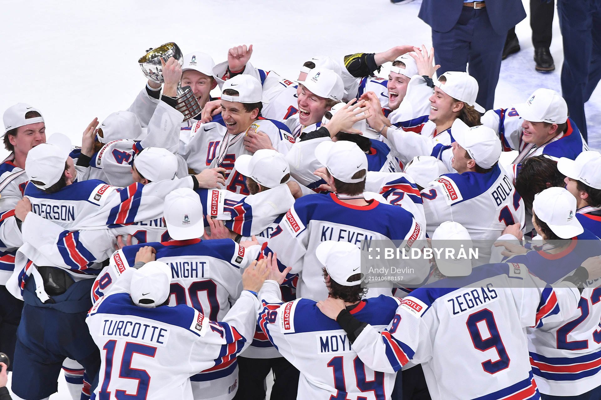 Team USA celebrates with the championship trophy