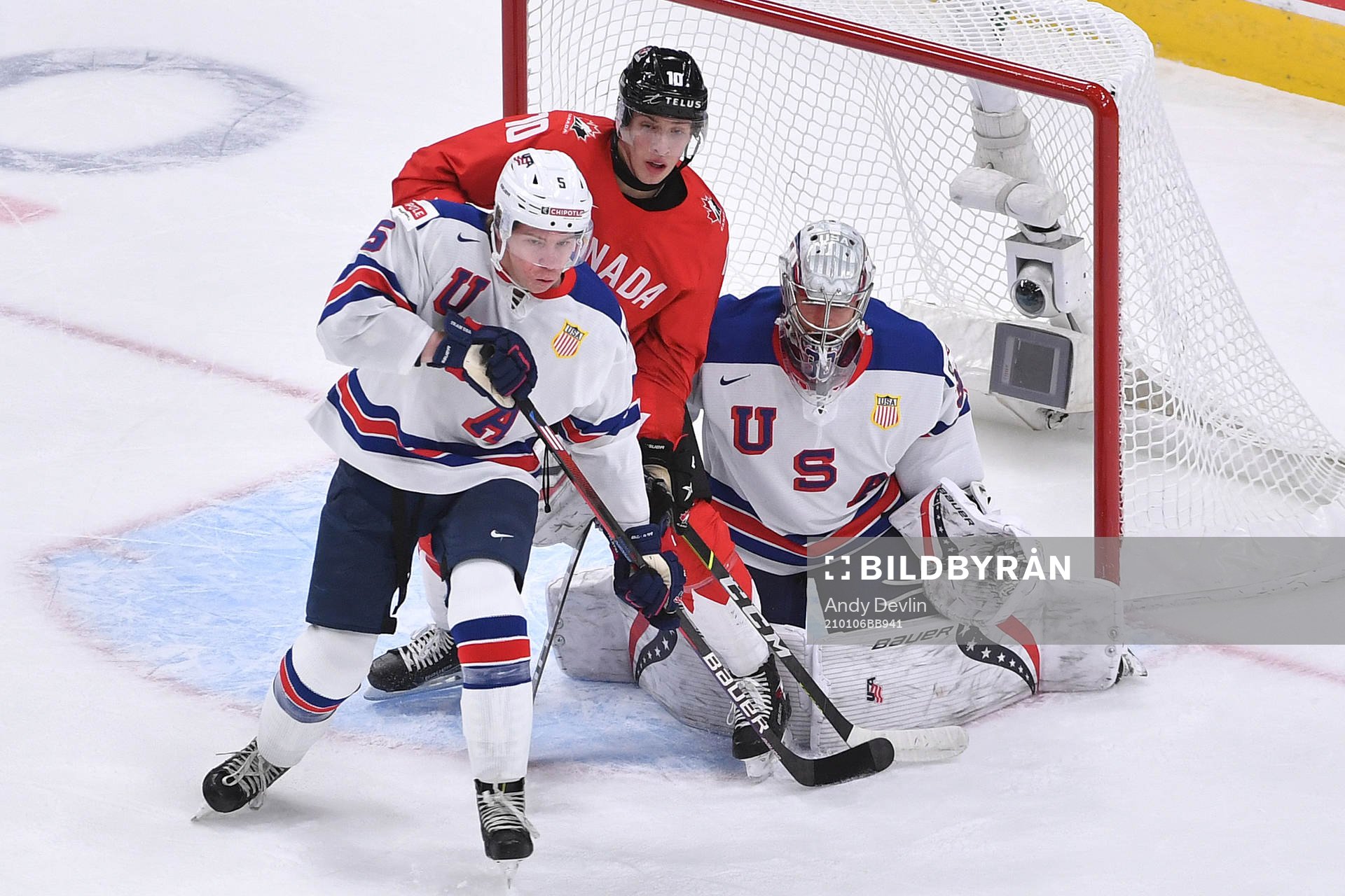 Dylan Holloway of Canada and Jackson LaCombe of USA battle