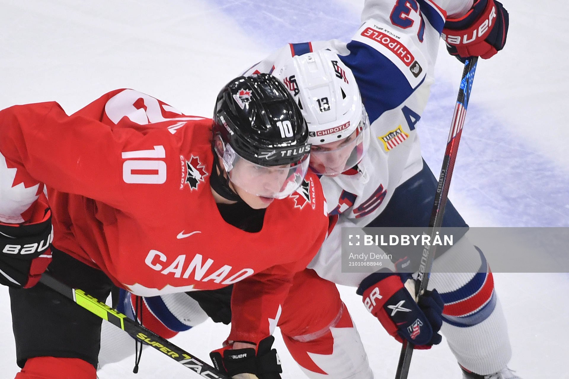Dylan Holloway of Canada and Cole Caufield of USA battle