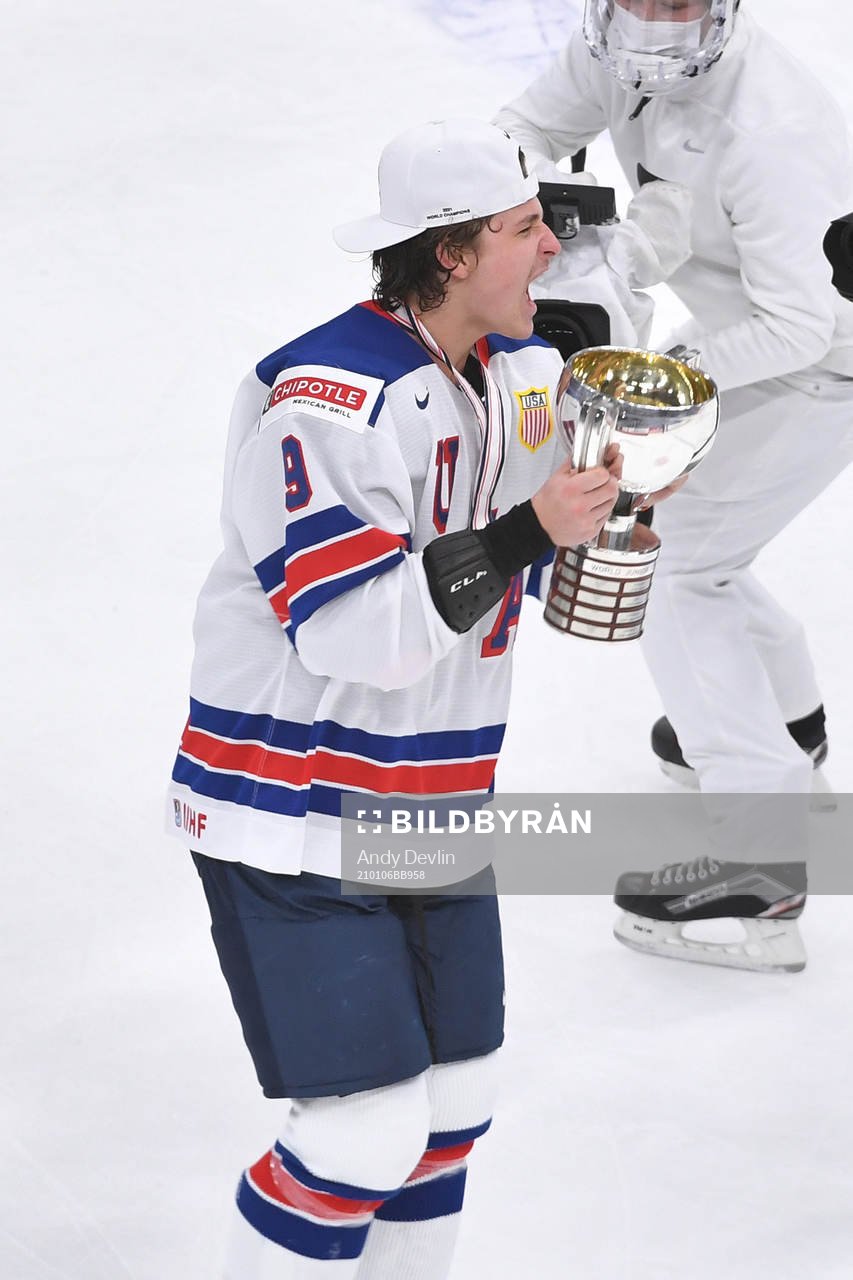 Trevor Zegras of USA celebrates with the first place trophy