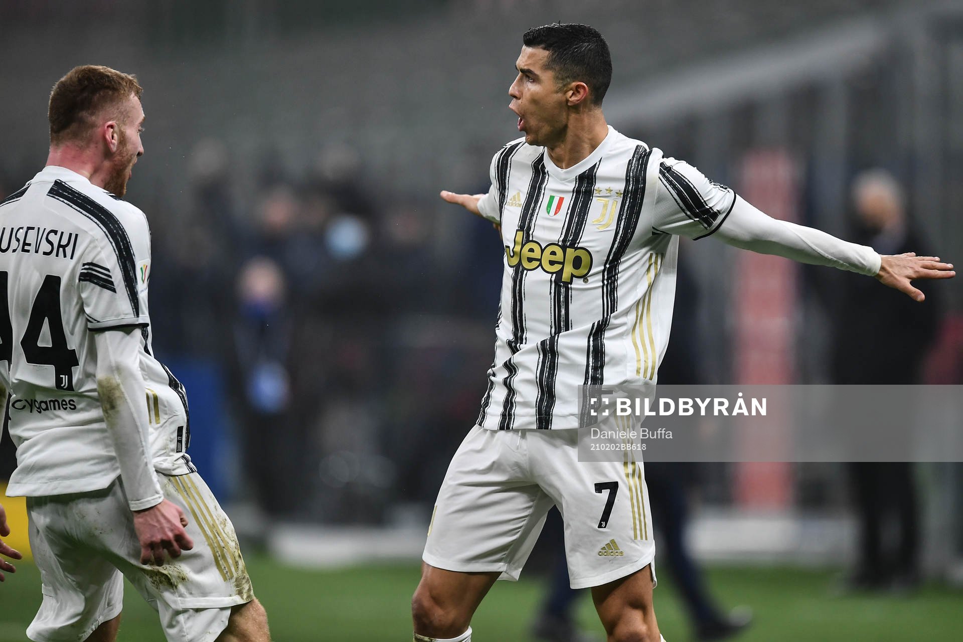 Cristiano Ronaldo celebrate with Dejan Kulusevski of Juventus and teammates during the Coppa Italia Semifinal football match on February 2, 2021 in Milano .