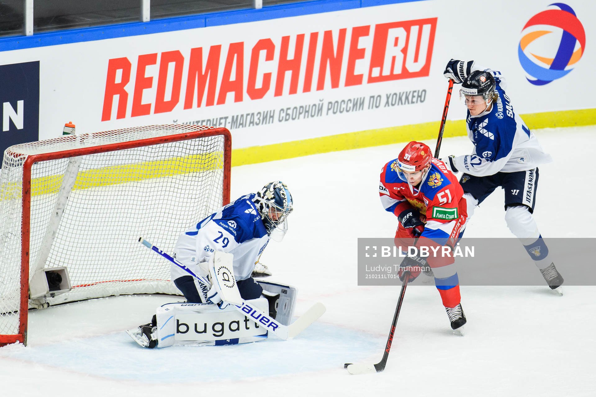 Nikolai Kovalenko of Russia and goalkeeper Harri Säteri of