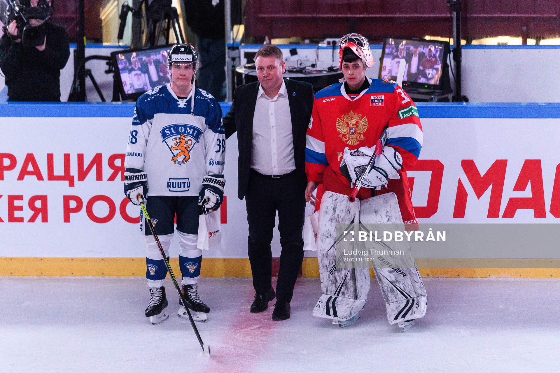 Jere Innala of Finland and goalkeeper Alexander Samonov of