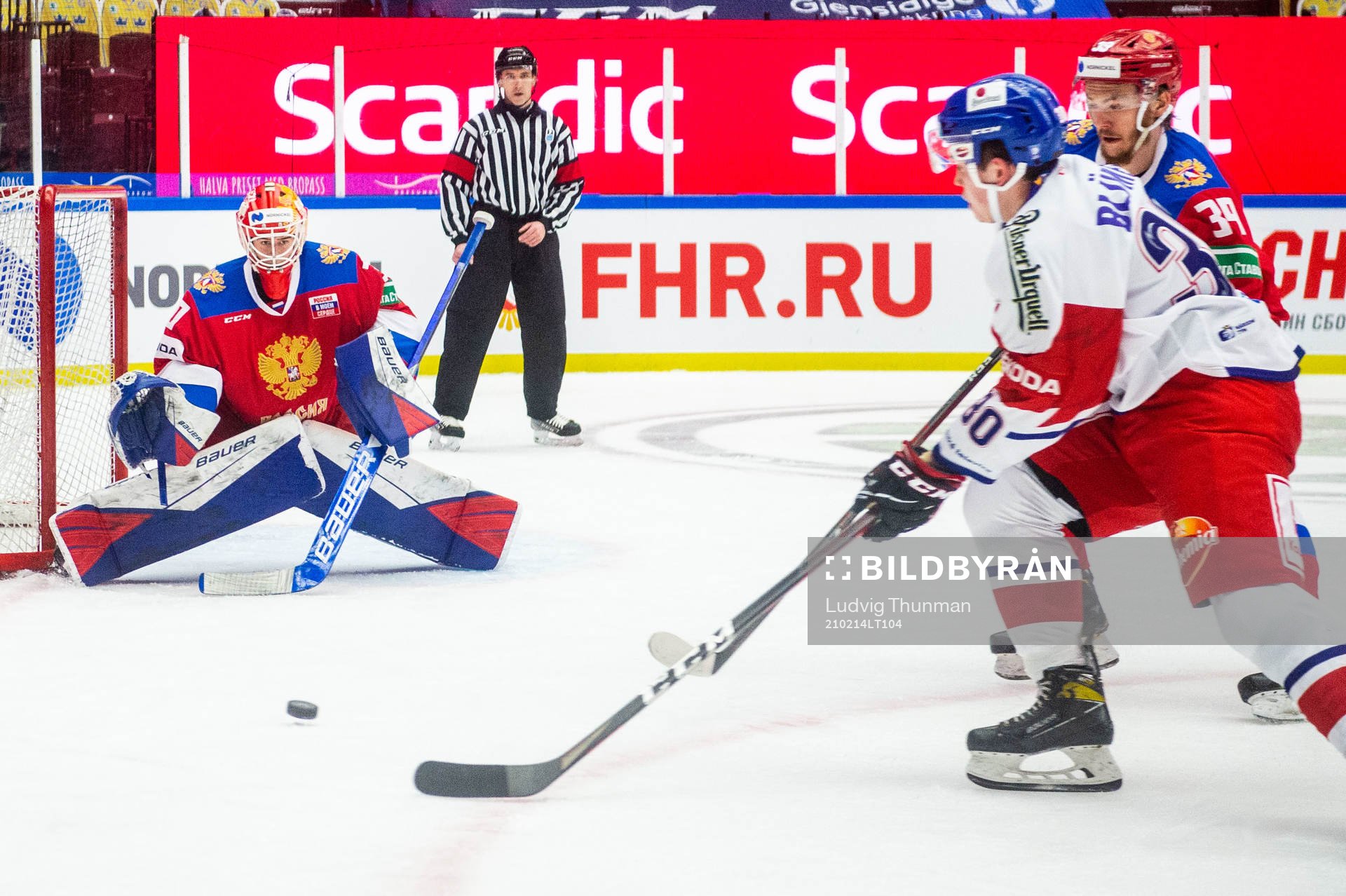 Goalkeeper Yaroslav Askarov of Russia and Matej Blumel of