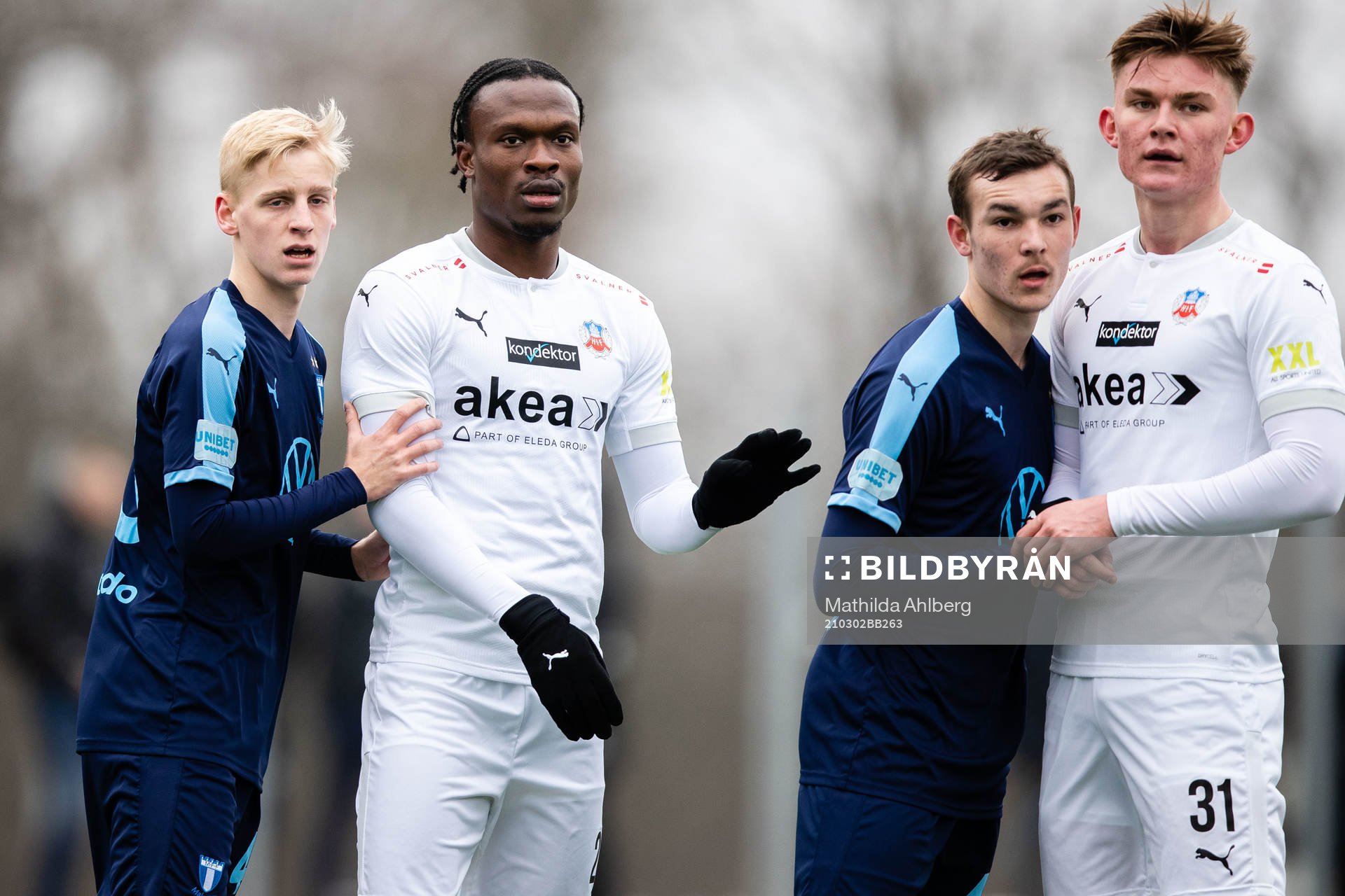 Malmö FFs Emil Lindman och Alexander Nilsson och Helsingborgs Alhaji Gero och Lucas Larsen under fotbollsmatchen i träningsmatchen mellan Helsingborg och Malmö FF den 2 mars 2021 i Helsingborg.