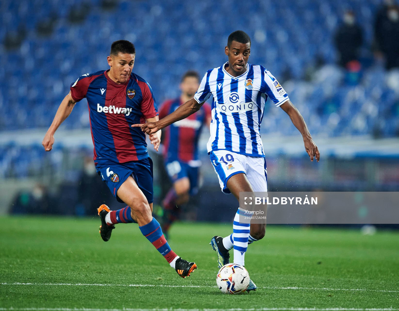 Alexander Isak of Real Sociedad duels for the ball with