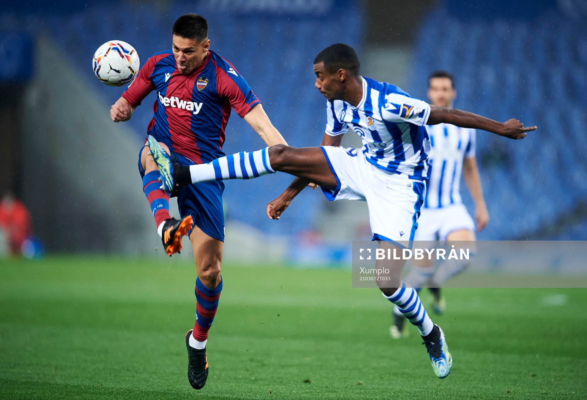 Alexander Isak of Real Sociedad duels for the ball with Oscar Duarte of Levante UD during the La Liga football match between Real Sociedad and Levante on March 7, 2021 in San Sebastian, Spain.
