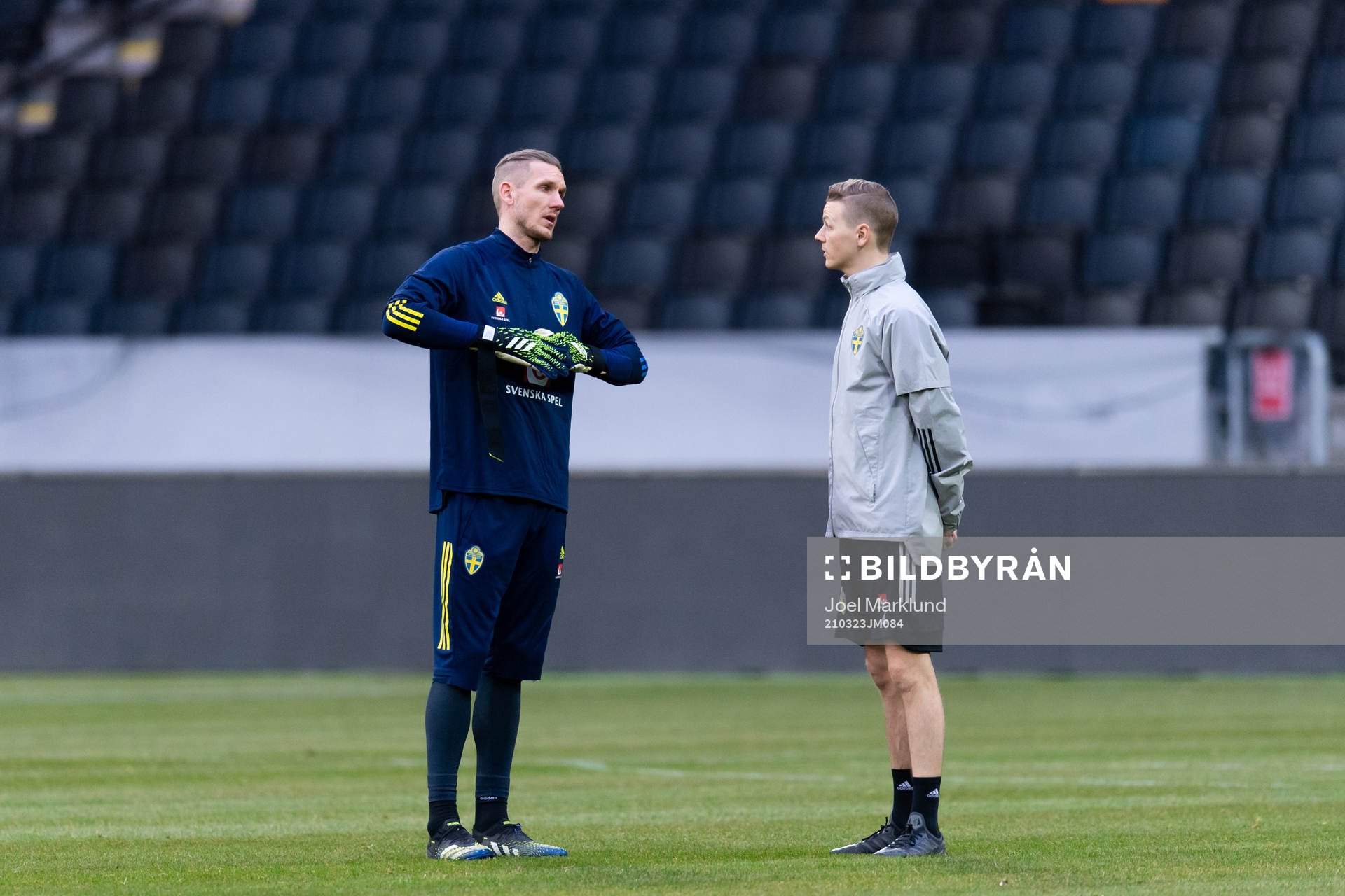 Robin Olsen and goalkeeper coach Mats Elfvendahl of the