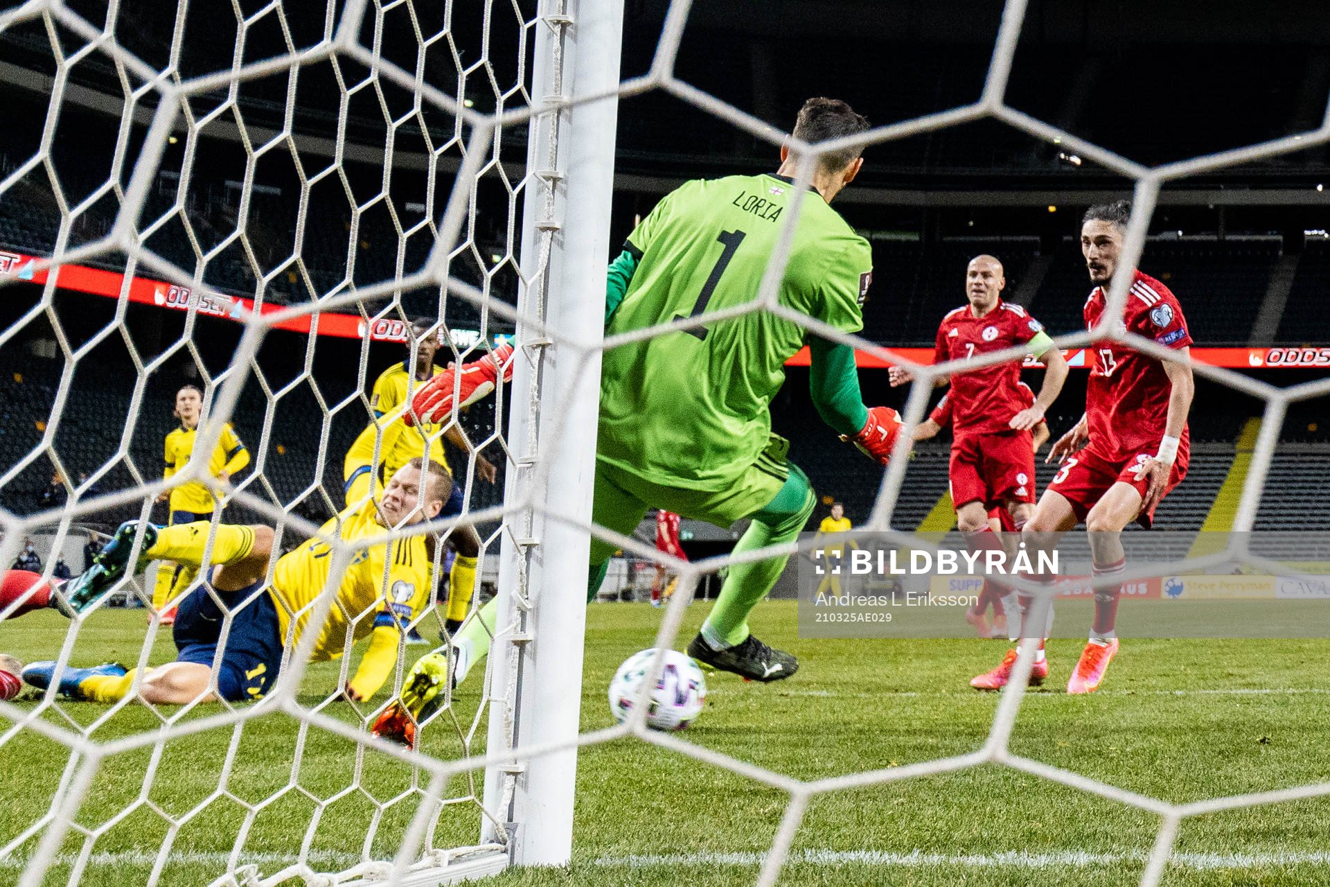 Viktor Claesson of Sweden scores 1-0 passed goalkeeper