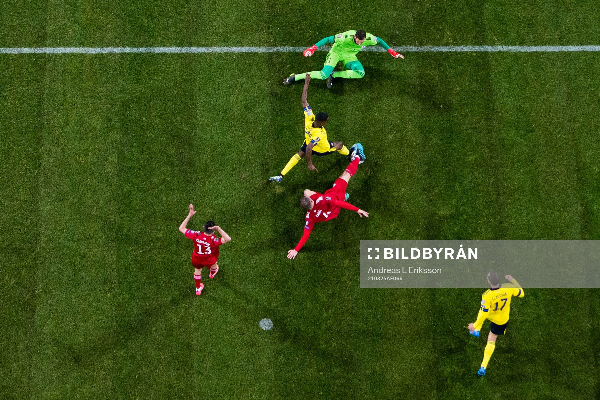 Alexander Isak of Sweden and goalkeeper Giorgi Loria of