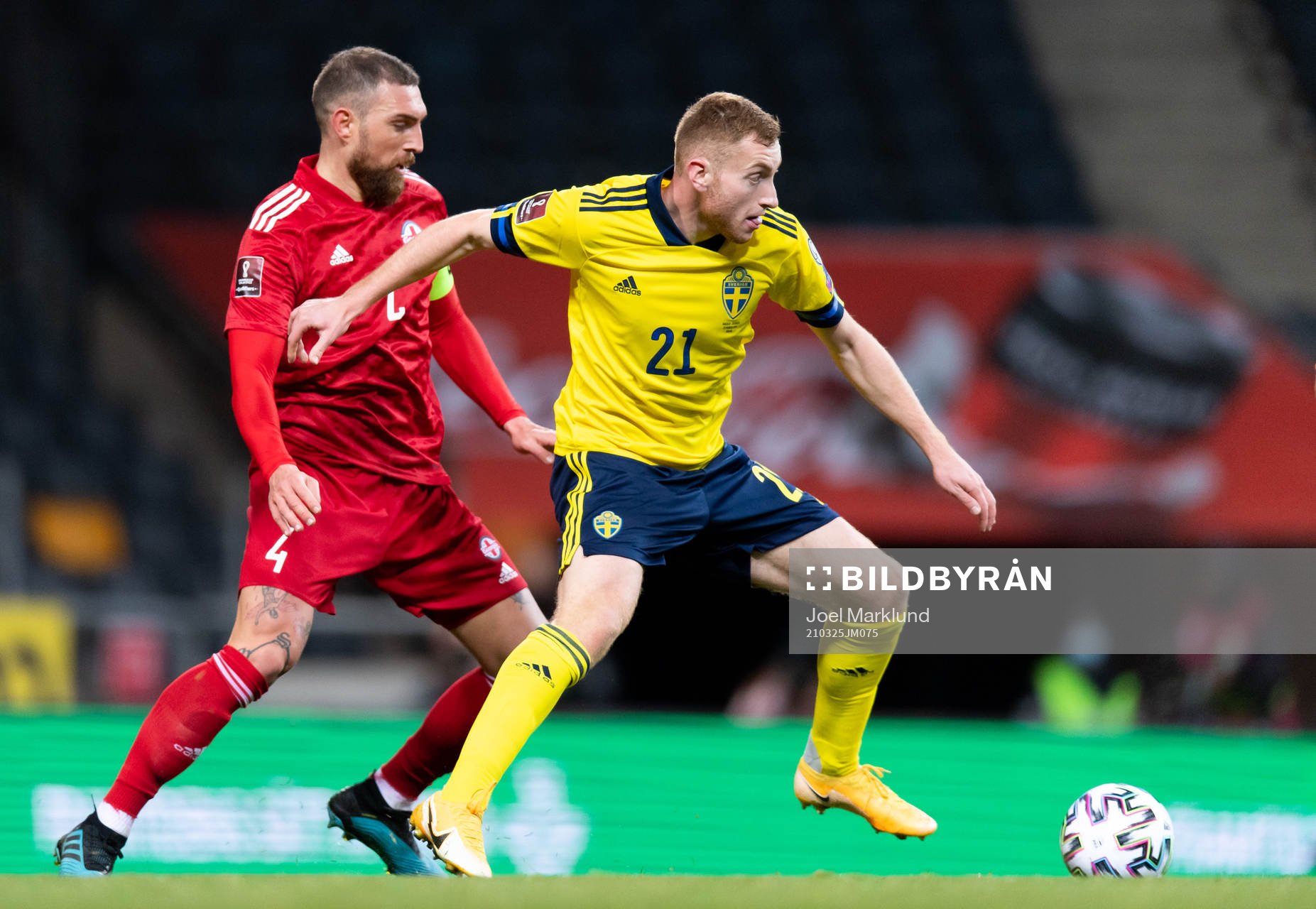 Guram Kashia of Georgia and Dejan Kulusevski of Sweden