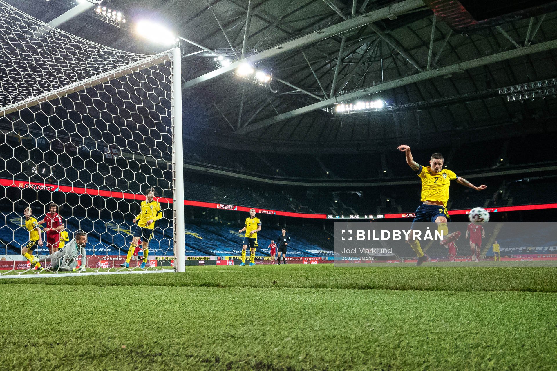 Mikael Lustig of Sweden stretches for the ball