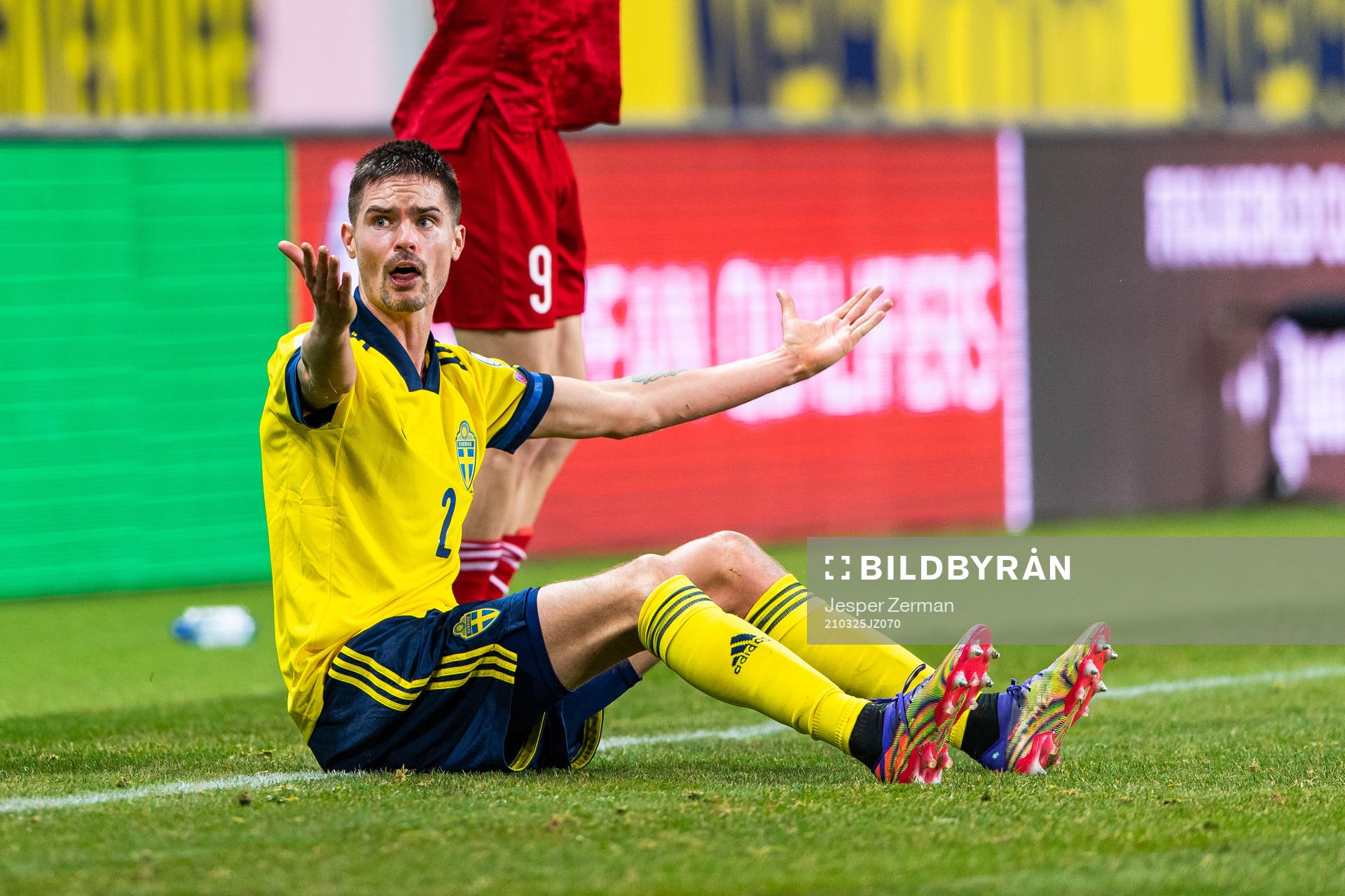 Mikael Lustig of Sweden reacts against the referee