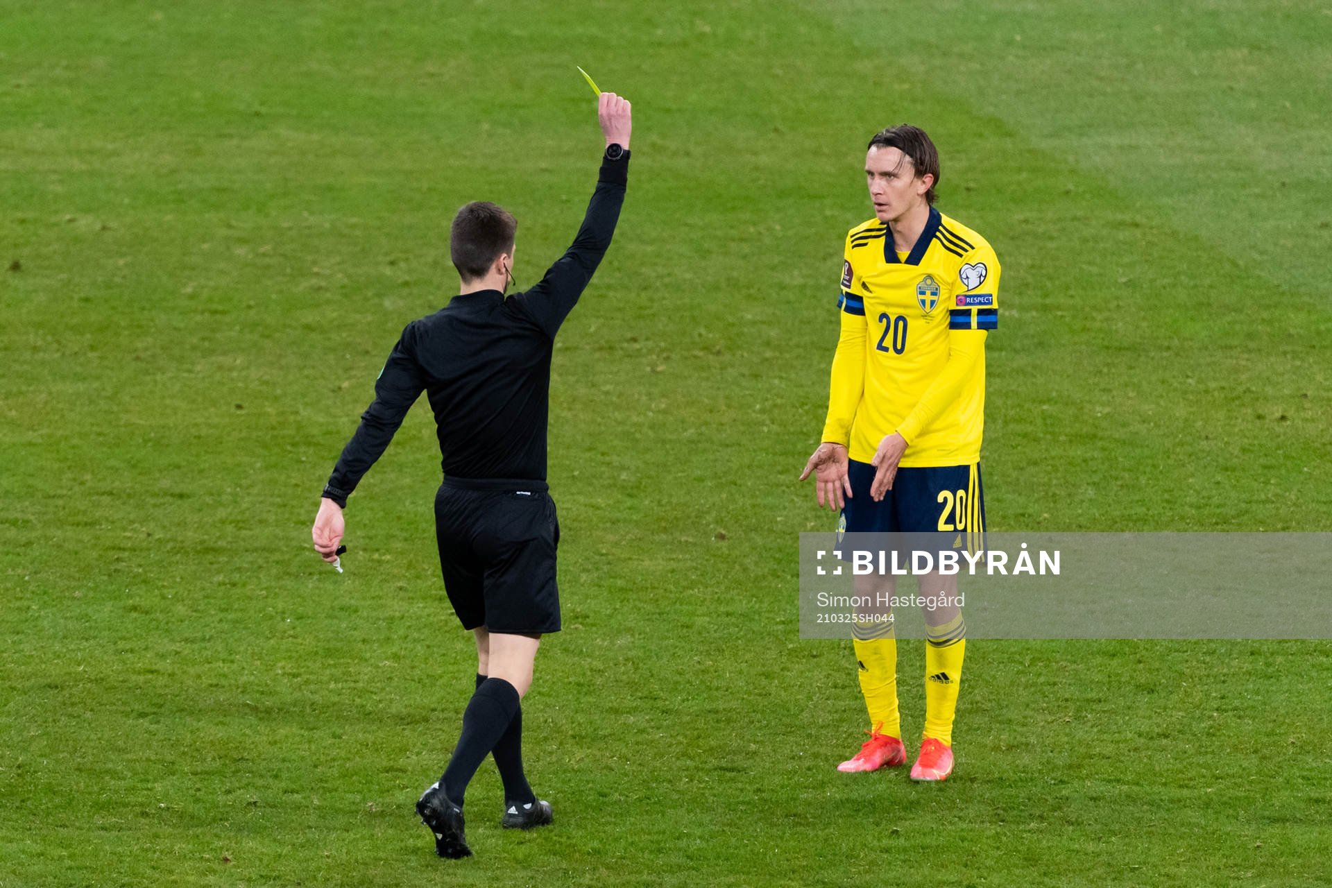Kristoffer Olsson of Sweden is shown a yellow card