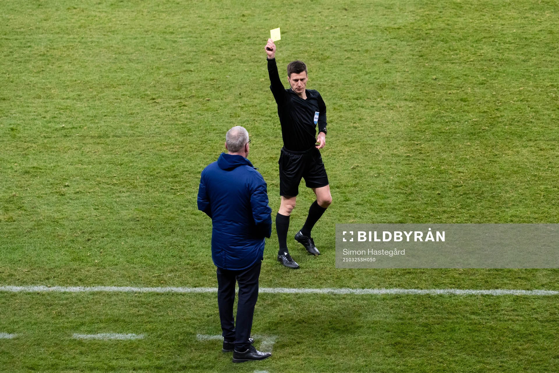 Janne Andersson, head coach of Sweden is shown a yellow card
