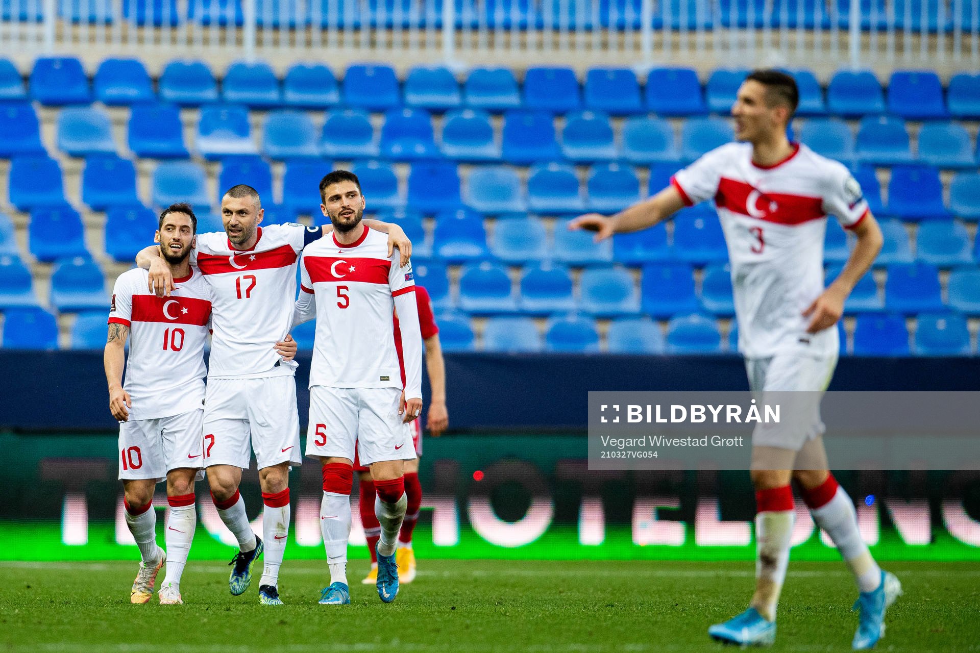 Hakan Çalhanoglu, Burak Yilmaz and Okay Yokuslu of Turkey celebrate after 0-3 during the FIFA World Cup Qualifier football match between Norway and Turkey on March 27, 2021 in Malaga.