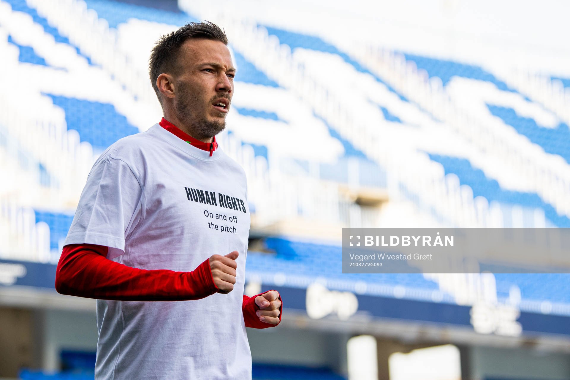 Martin Linnes of Norway warms up wearing a t-shirt with the