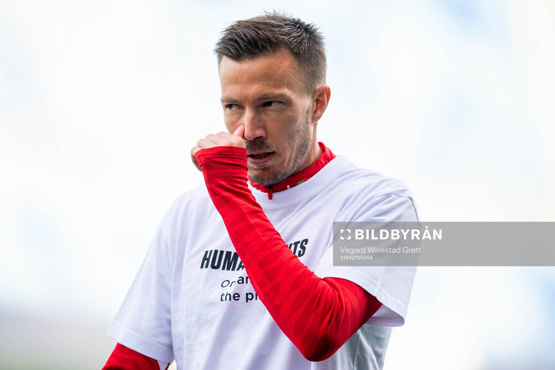 Martin Linnes of Norway warms up wearing a t-shirt with the