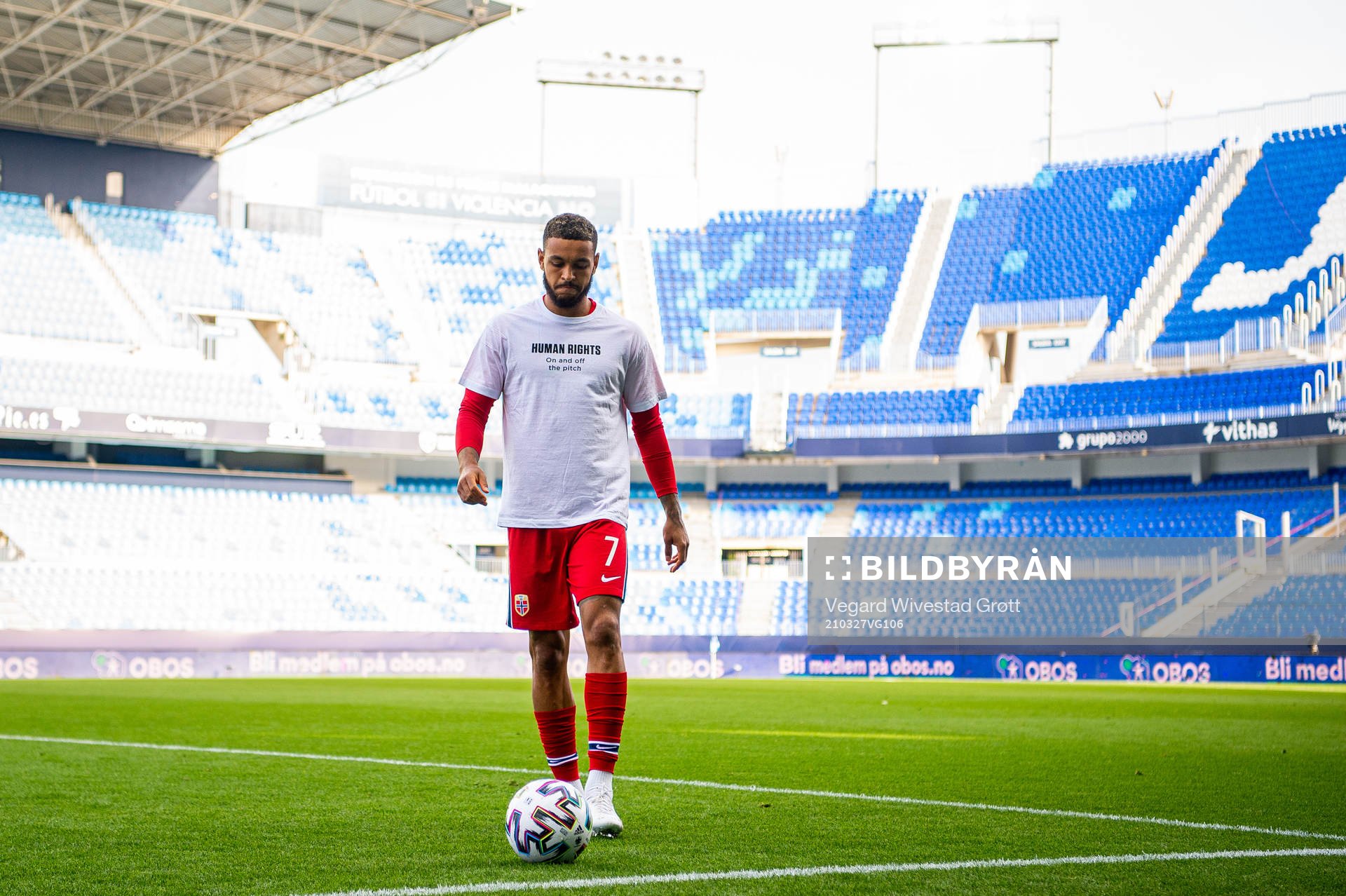 Joshua King of Norway warms up wearing a t-shirt with the