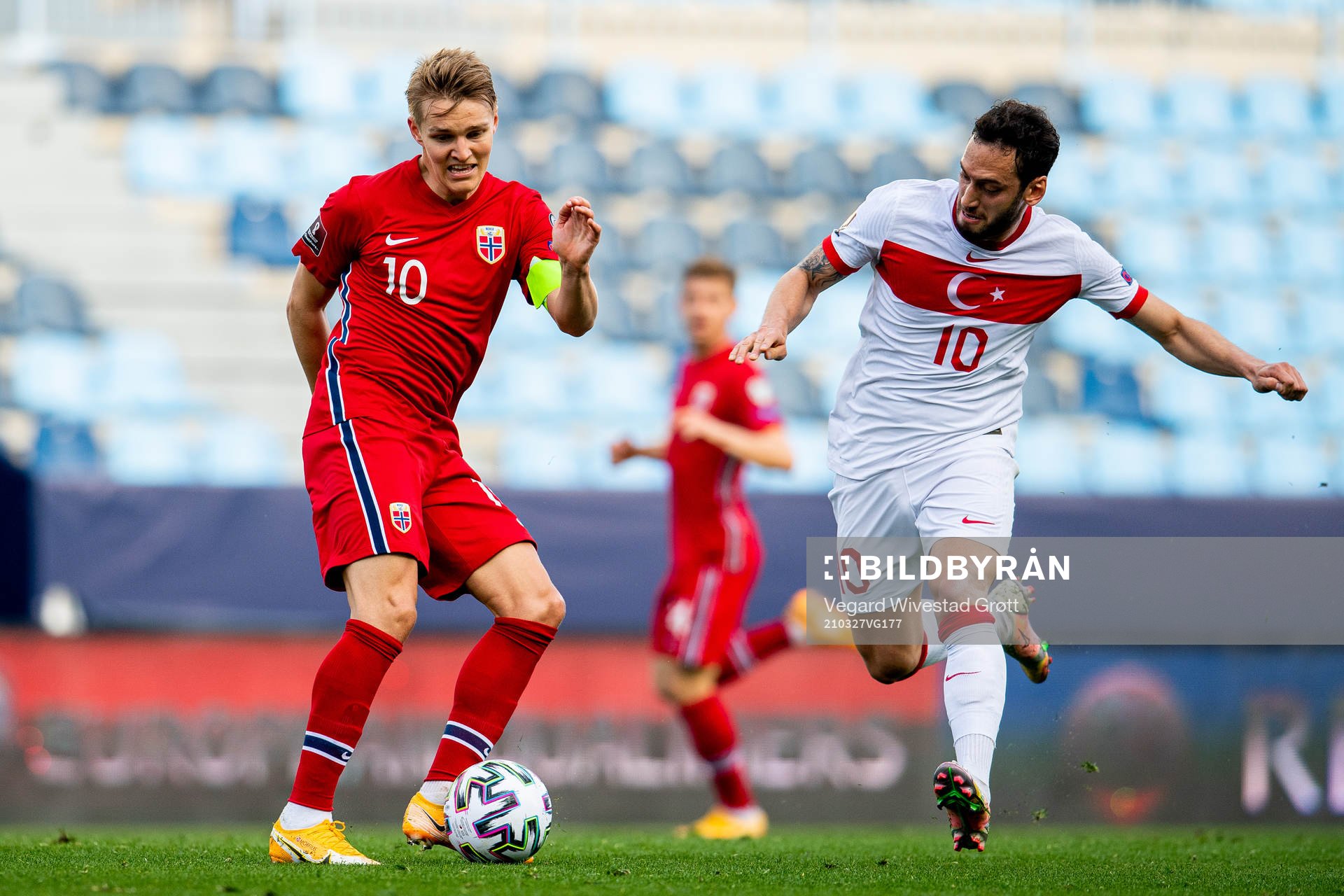 Martin Ødegaard of Norway and Hakan Çalhanoglu of Turkey