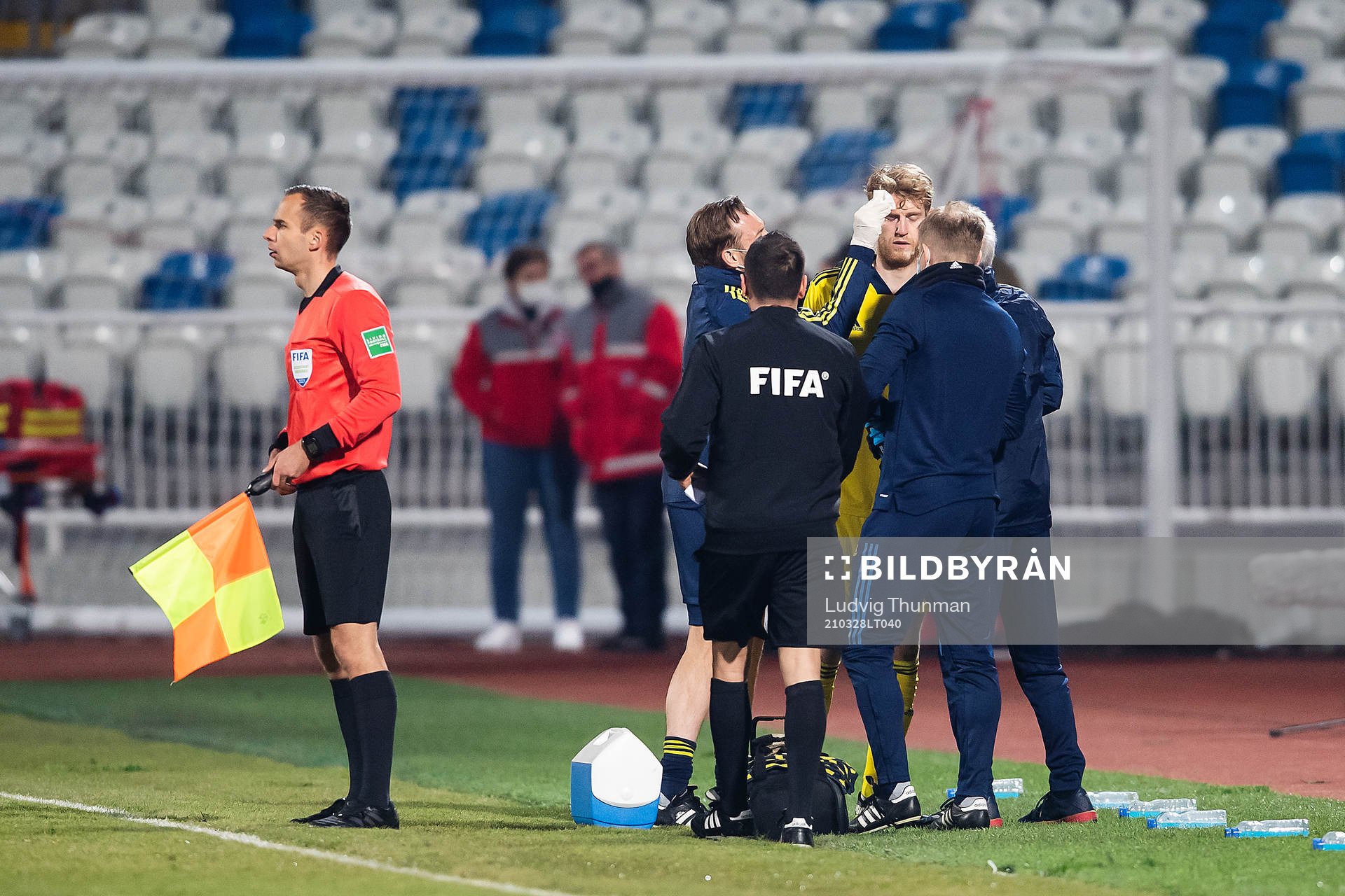 Filip Helander of Sweden receives medical treatment