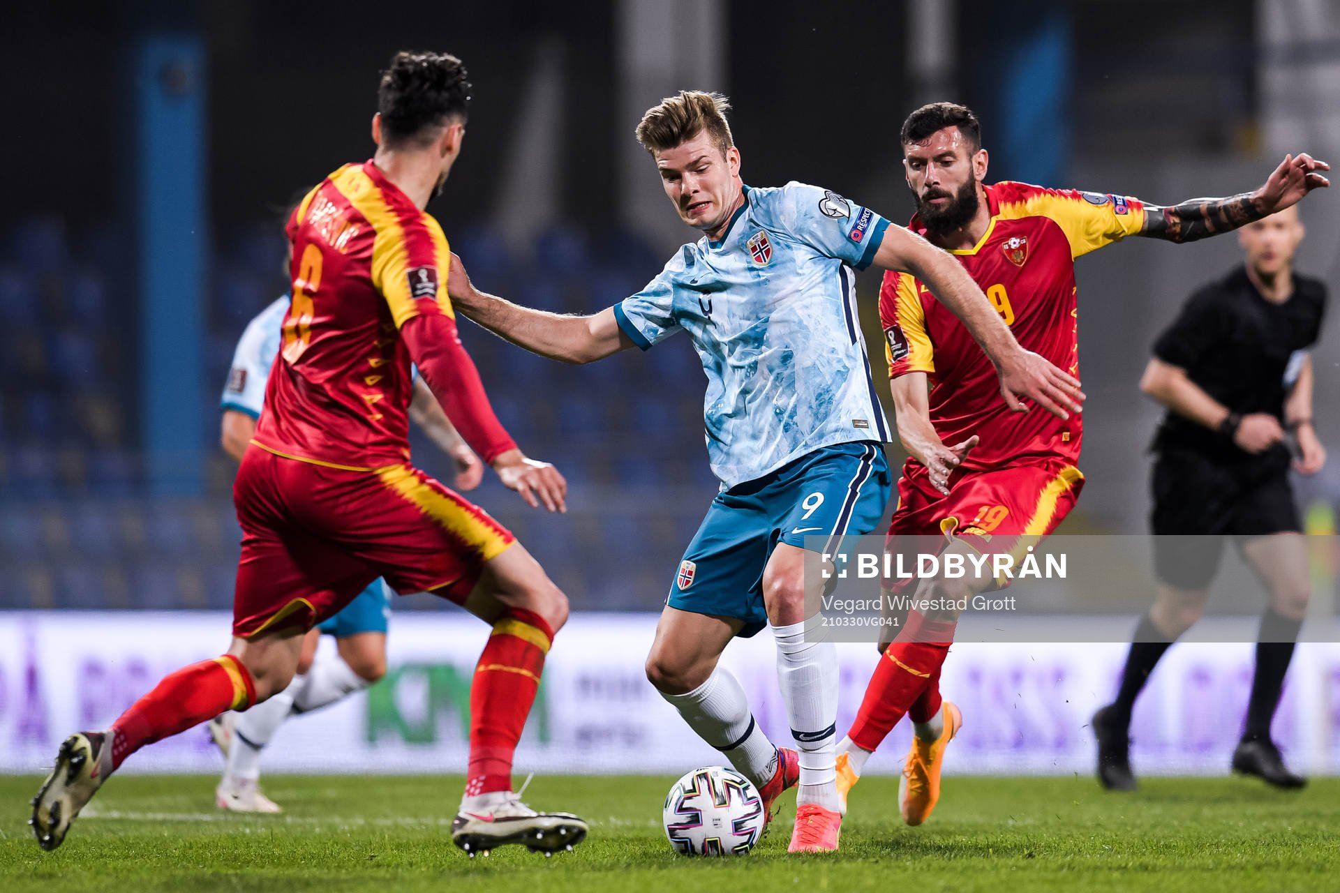 Alexander Sørloth of Norway against Zarko Tomasevic and Aleksandar Scekic of Montenegro during the FIFA World Cup Qualifier football match between Montenegro and Norway on March 30, 2021 in Podgorica.
