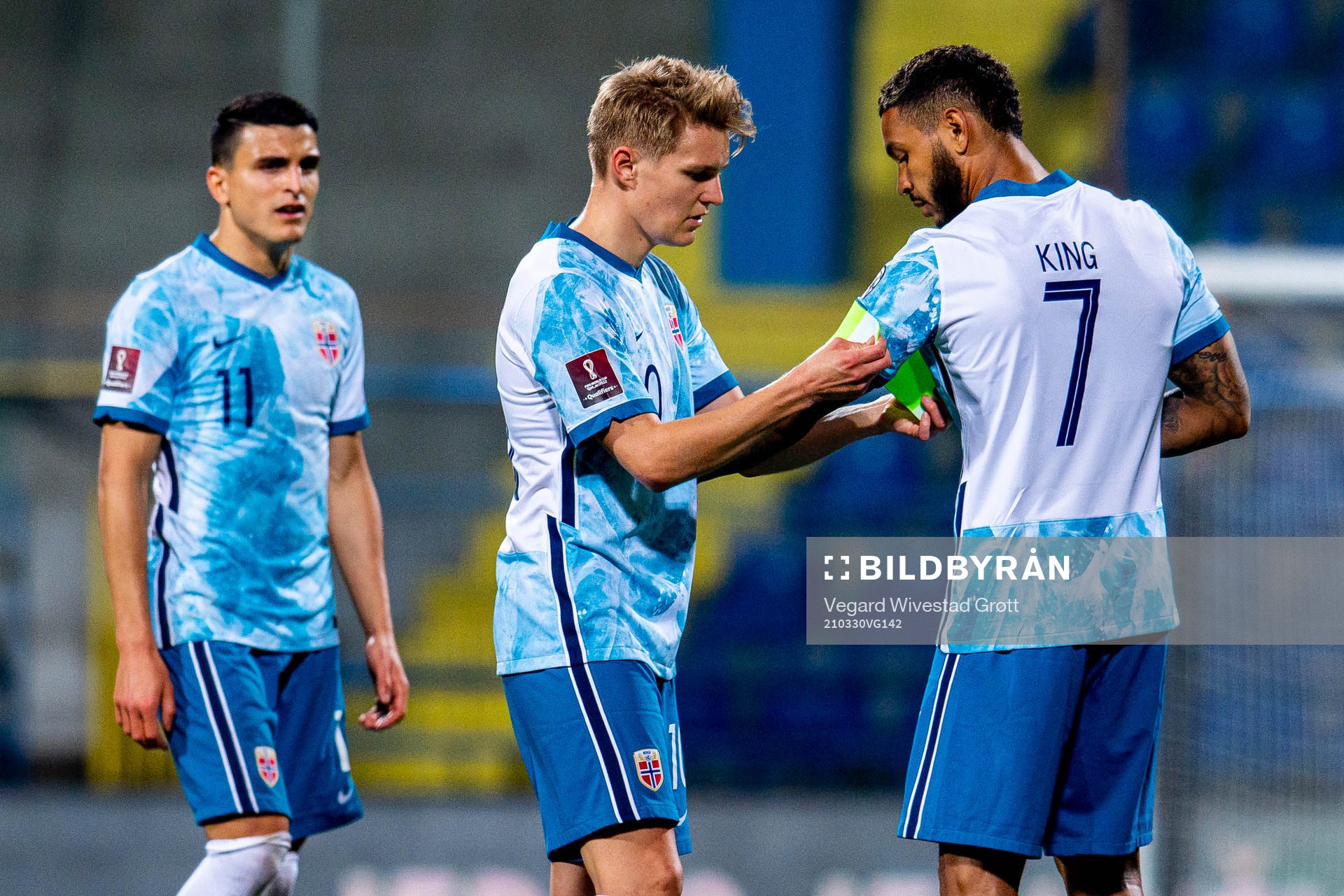 Martin Ødegaard of Norway gives the captain’s armband to