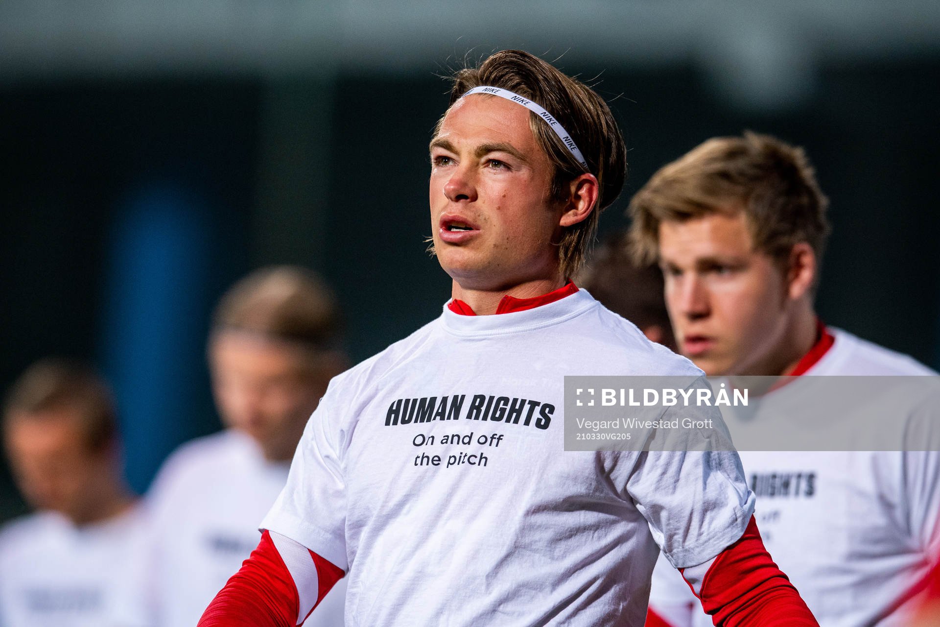 Patrick Berg of Norway warms up wearing a t-shirt with the