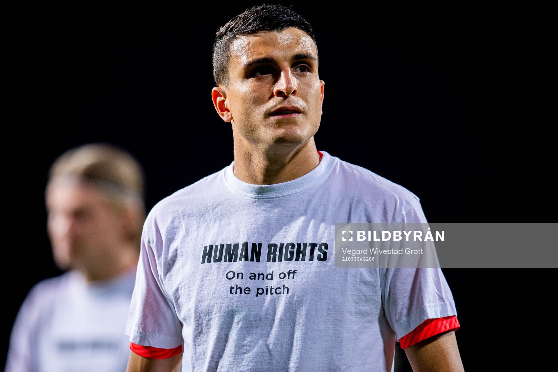 Mohamed Elyounoussi of Norway warms up wearing a t-shirt