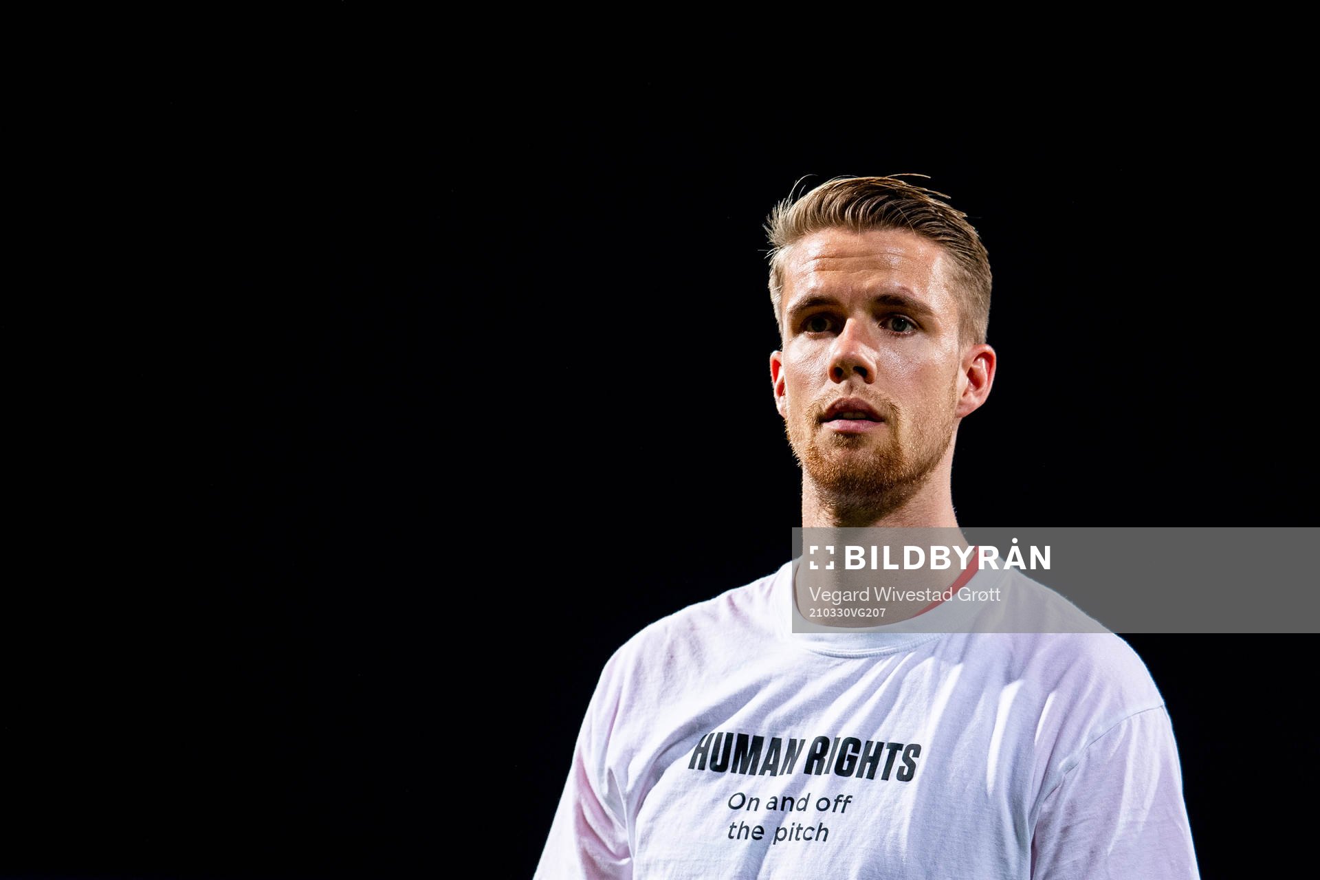 Kristoffer Ajer of Norway warms up wearing a t-shirt with
