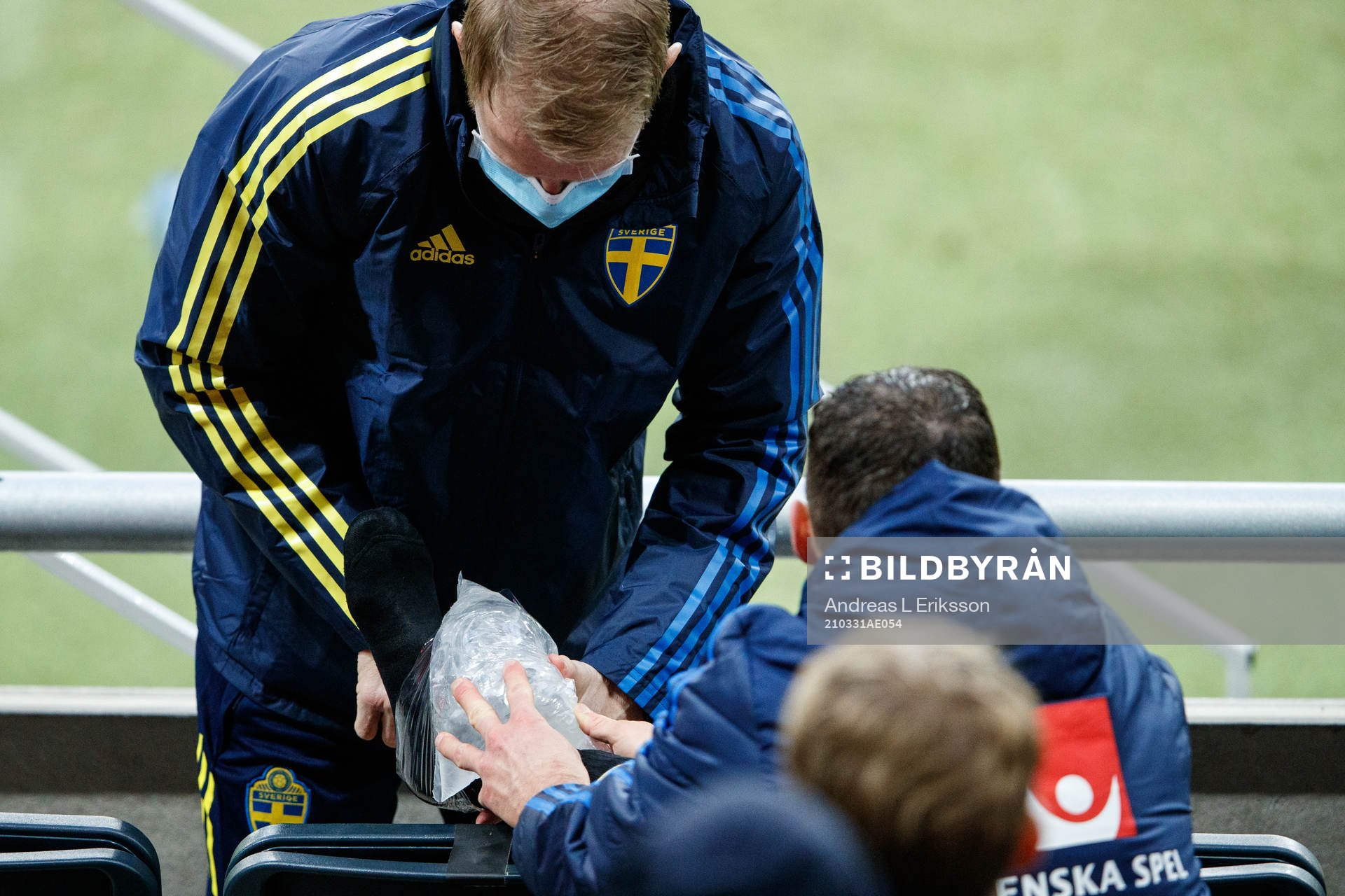 Marcus Berg of Sweden receives medical attention