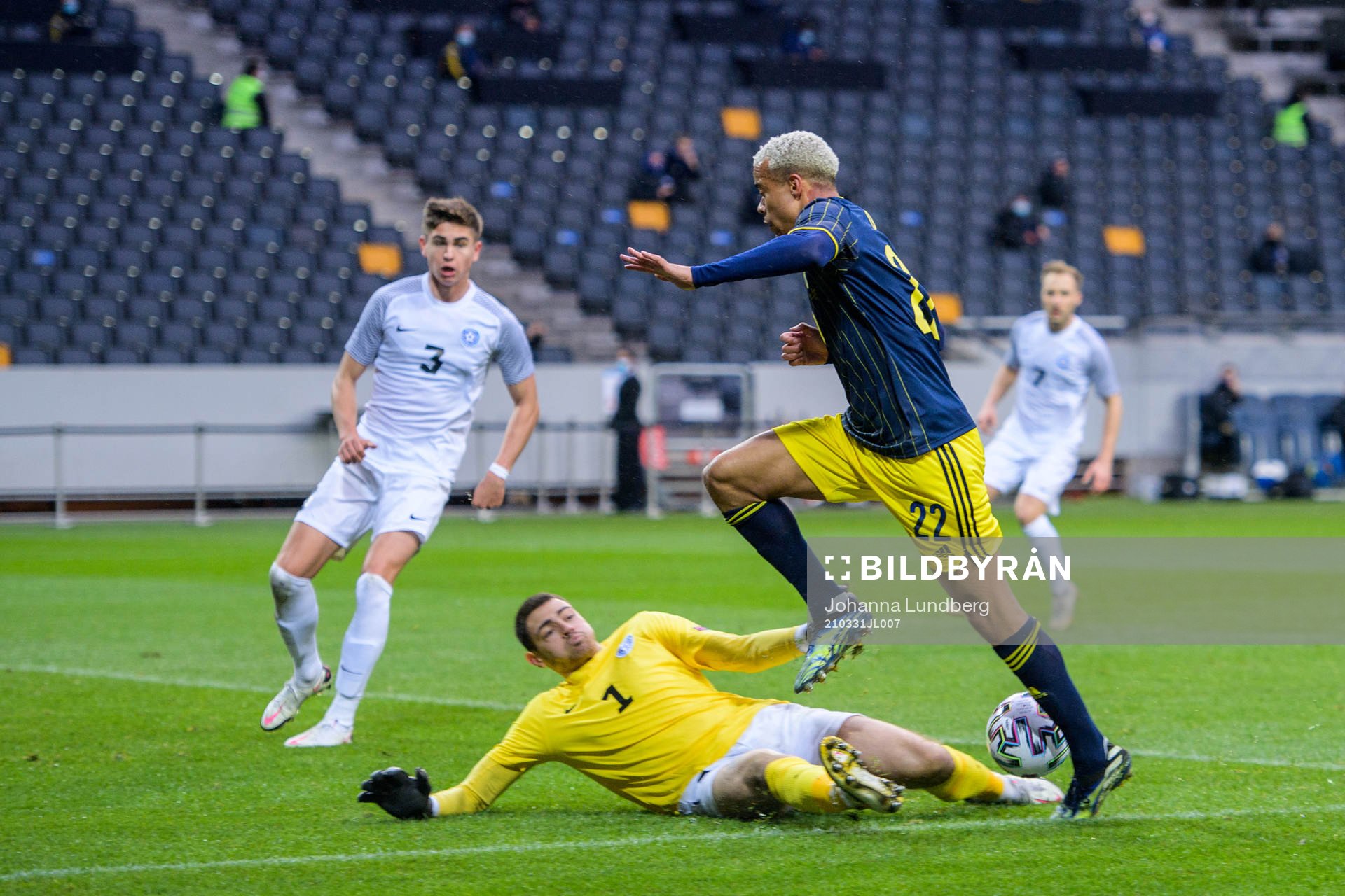goalkeeper Matvei Igonen of Estonia and Robin Quaison of