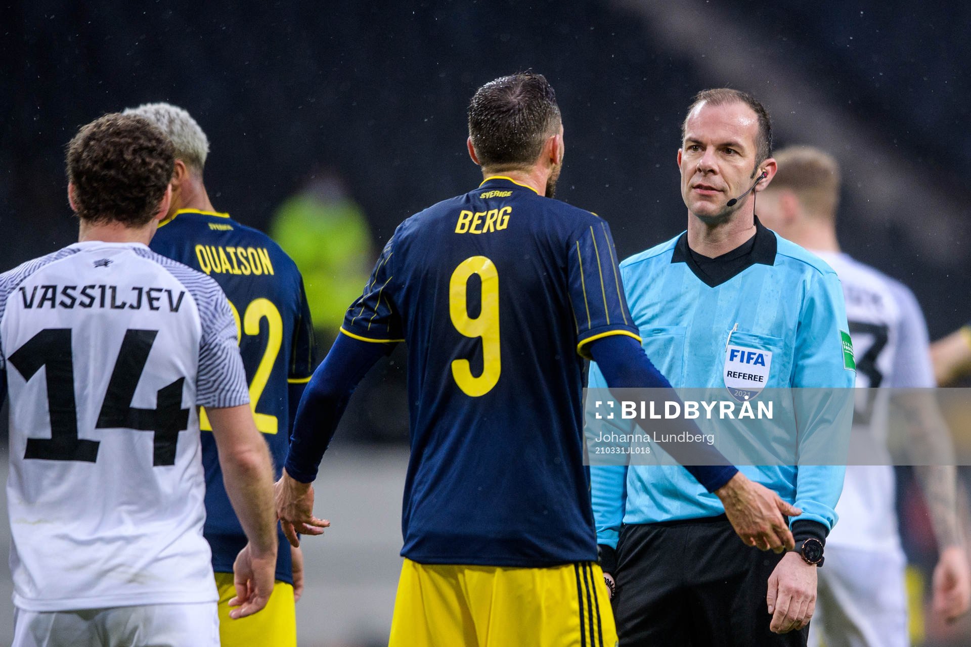 Marcus Berg of Sweden in a discussion with referee Marco