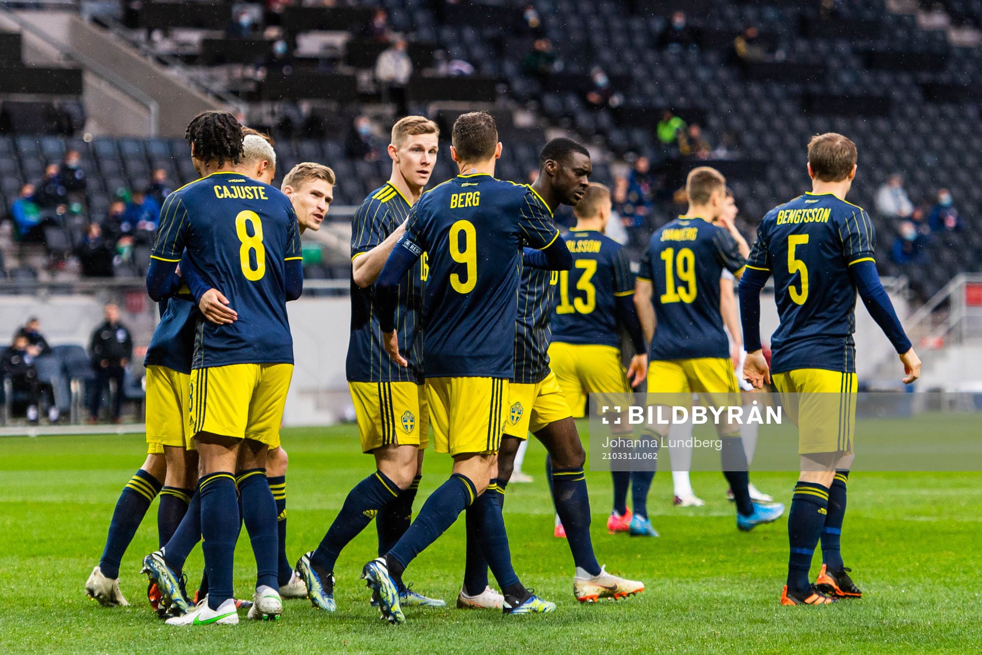 Marcus Berg celebrates with Jens-Lys Cajuste, Robin Quaison