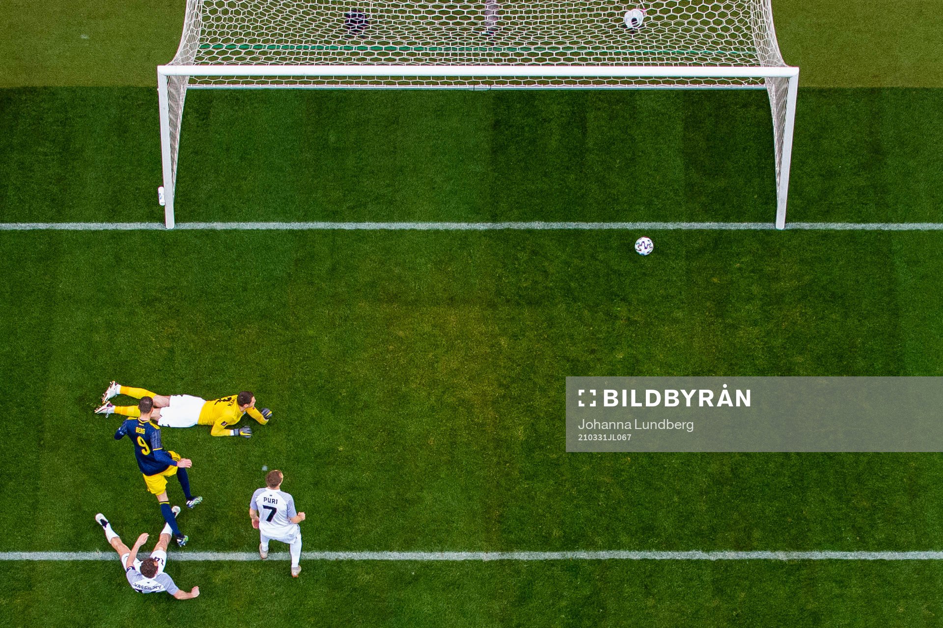 Marcus Berg of Sweden scores 1-0 beyond goalkeeper Matvei