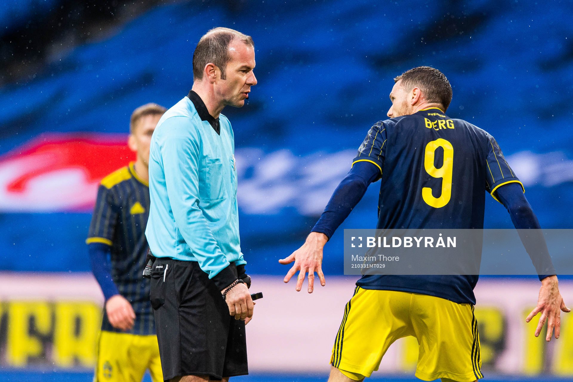 Referee Marco Fritz and Marcus Berg of Sweden