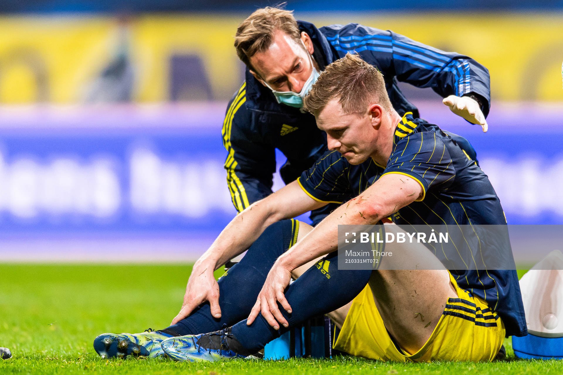 Emil Krafth of Sweden receives medical attention