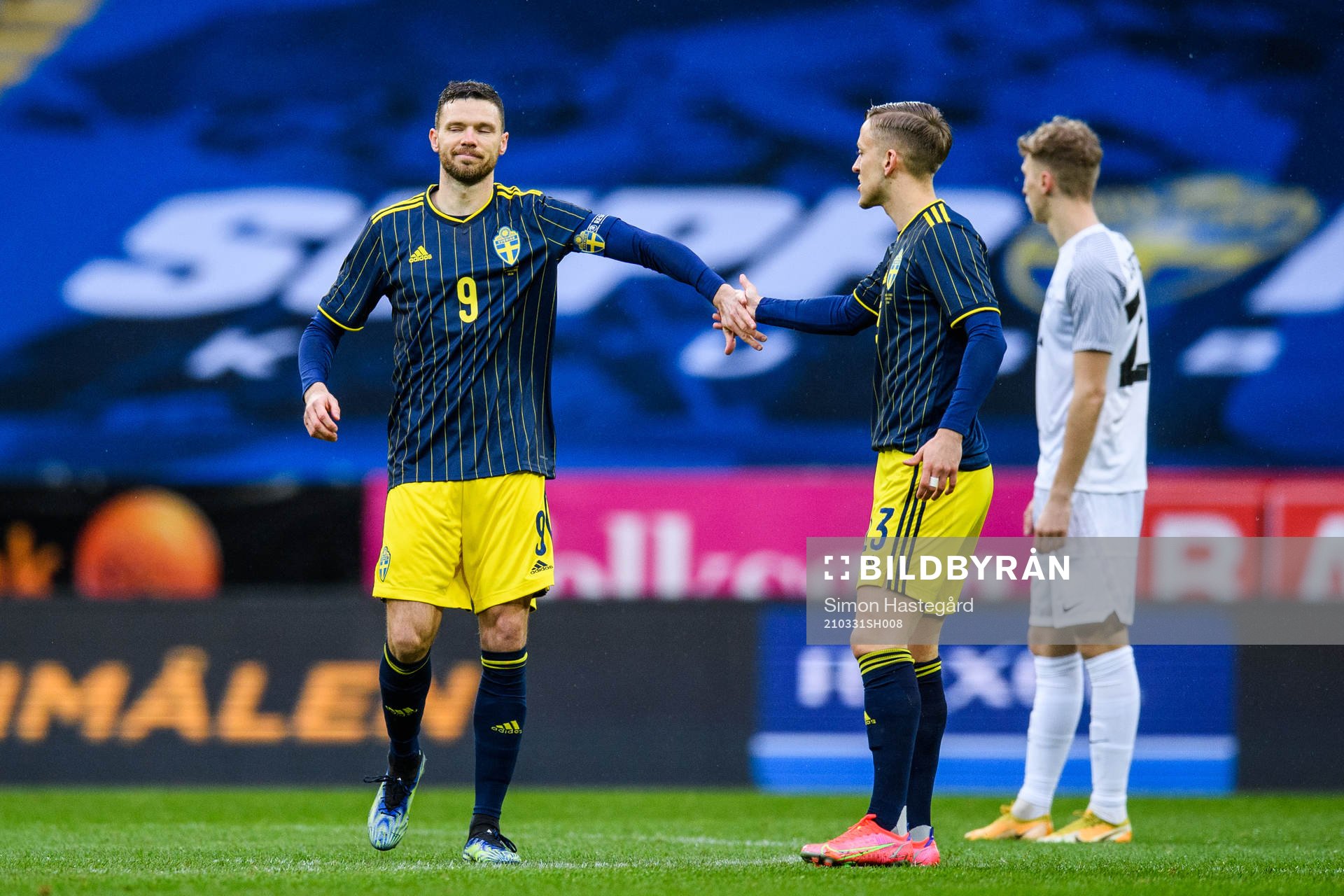 Marcus Berg and Jesper Karlsson of Sweden celebrate