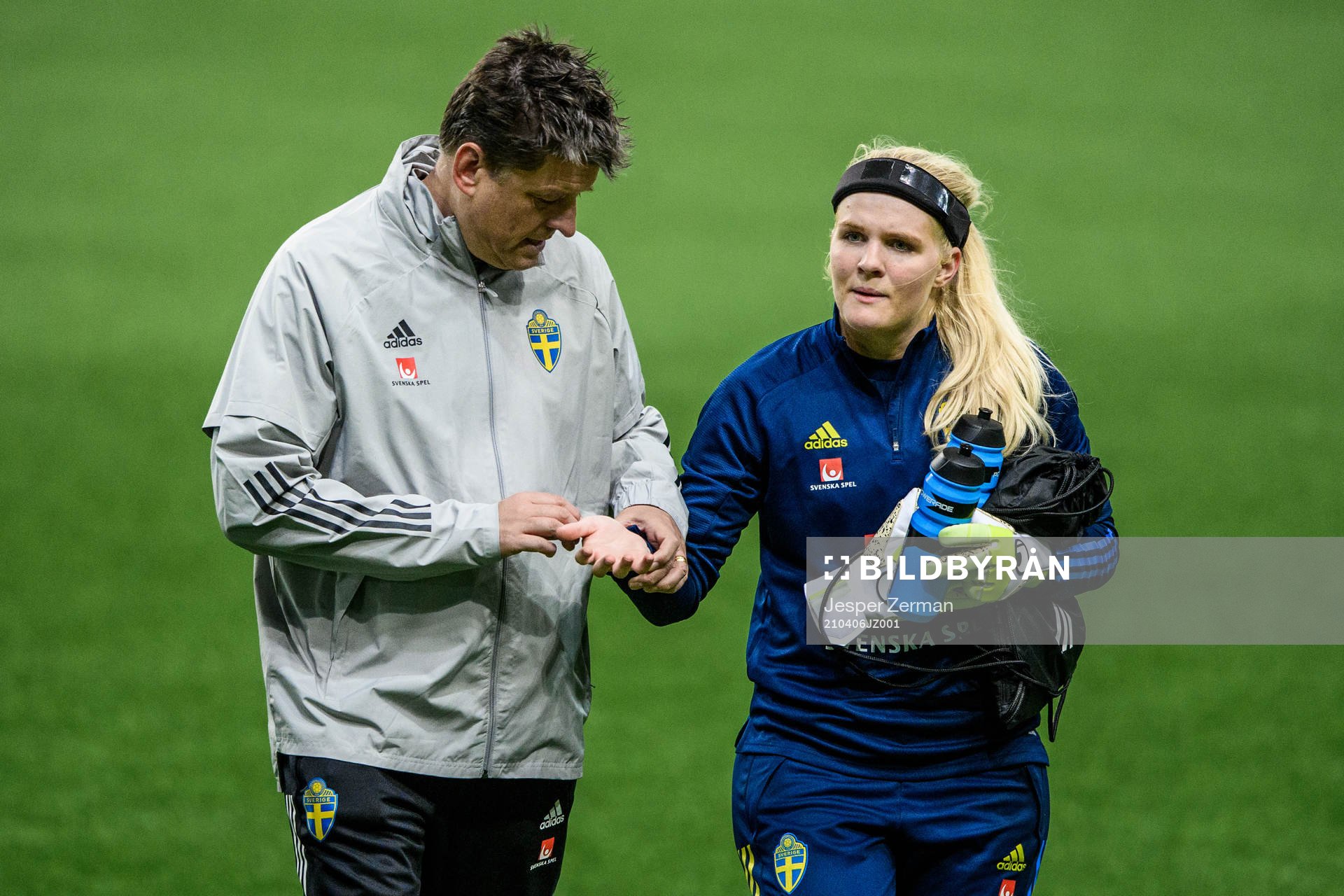 goalkeeper Emma Holmgren of Sweden receives medical