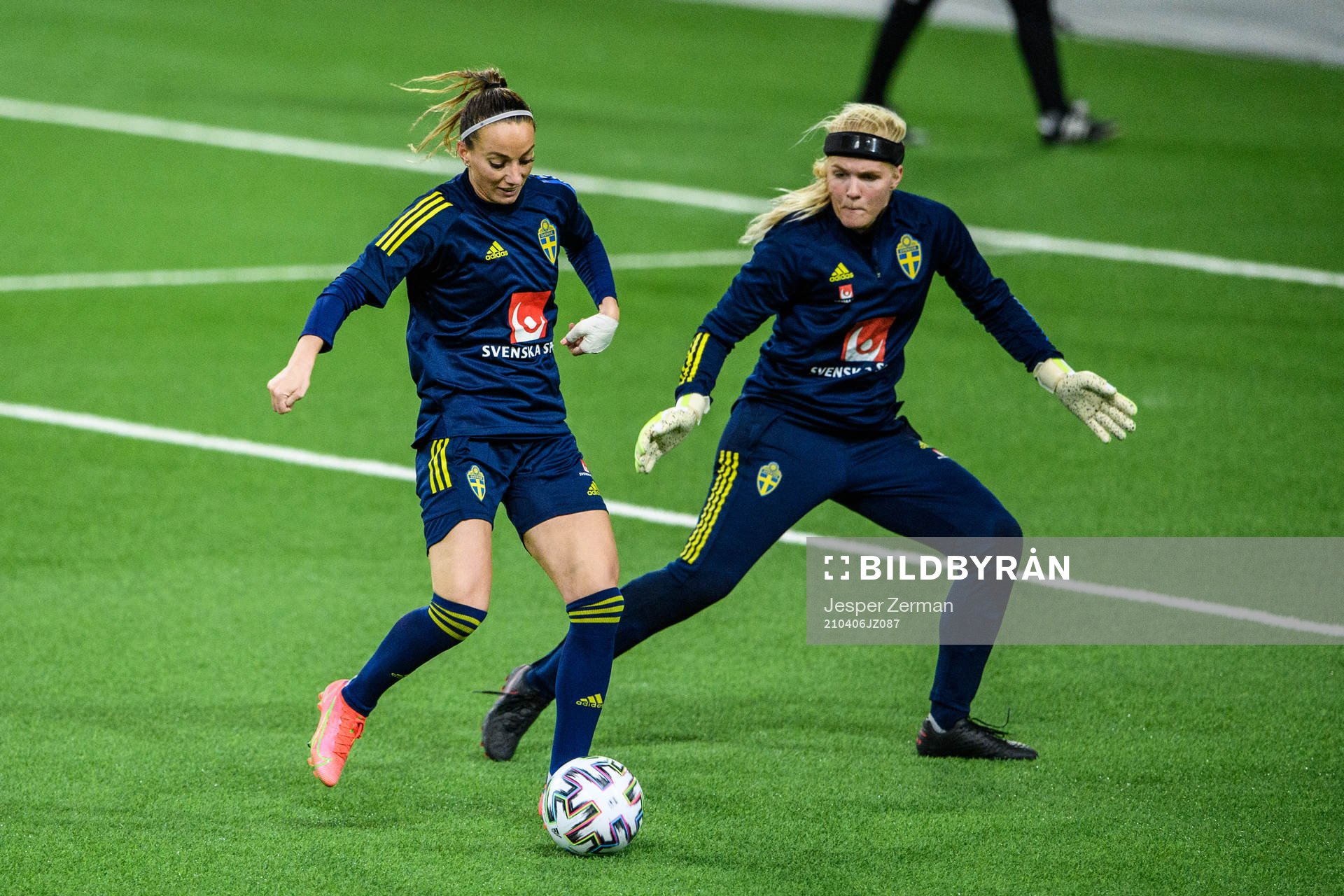 Kosovare Asllani and goalkeeper Emma Holmgren of Sweden