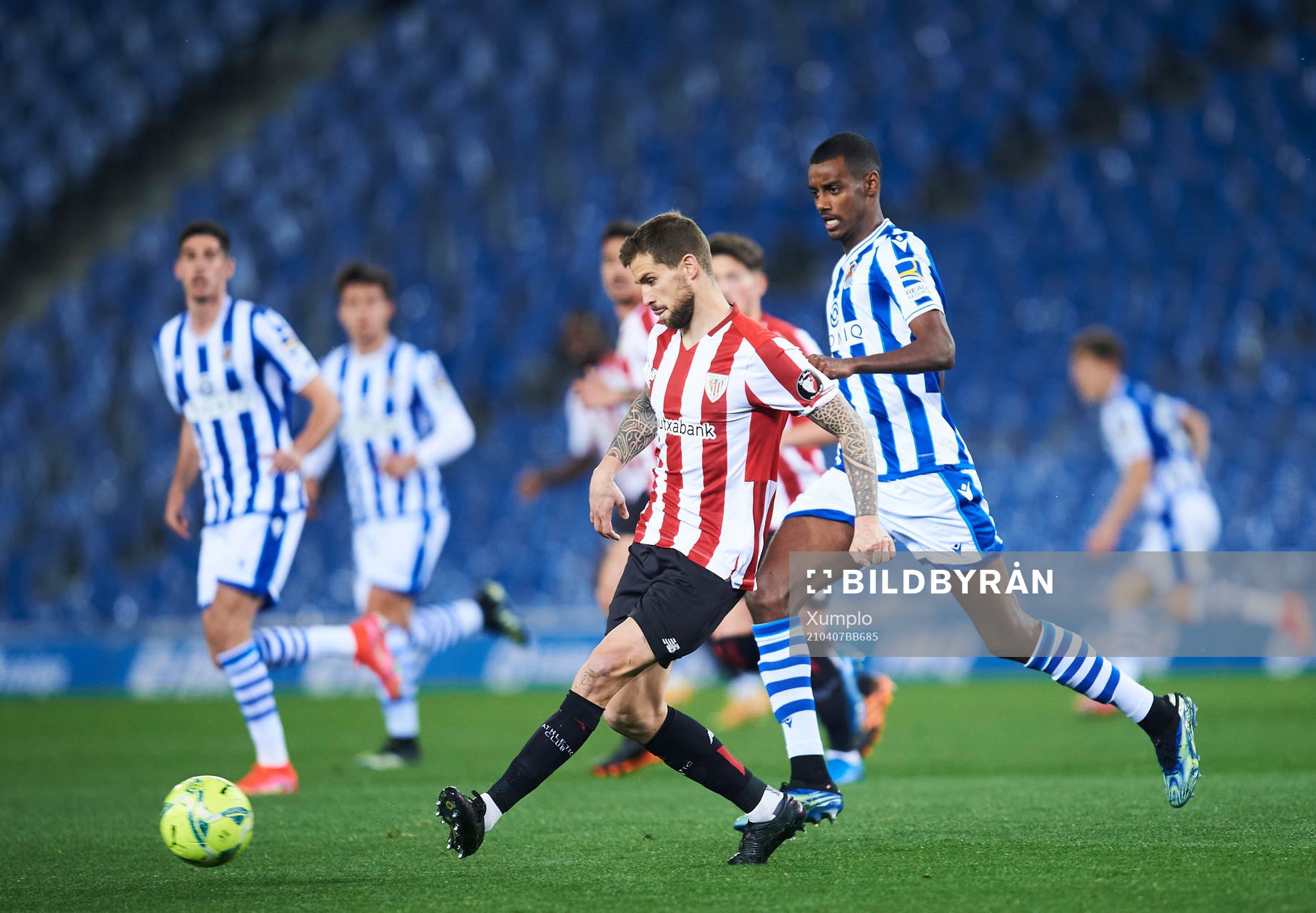 Alexander Isak of Real Sociedad duels for the ball with