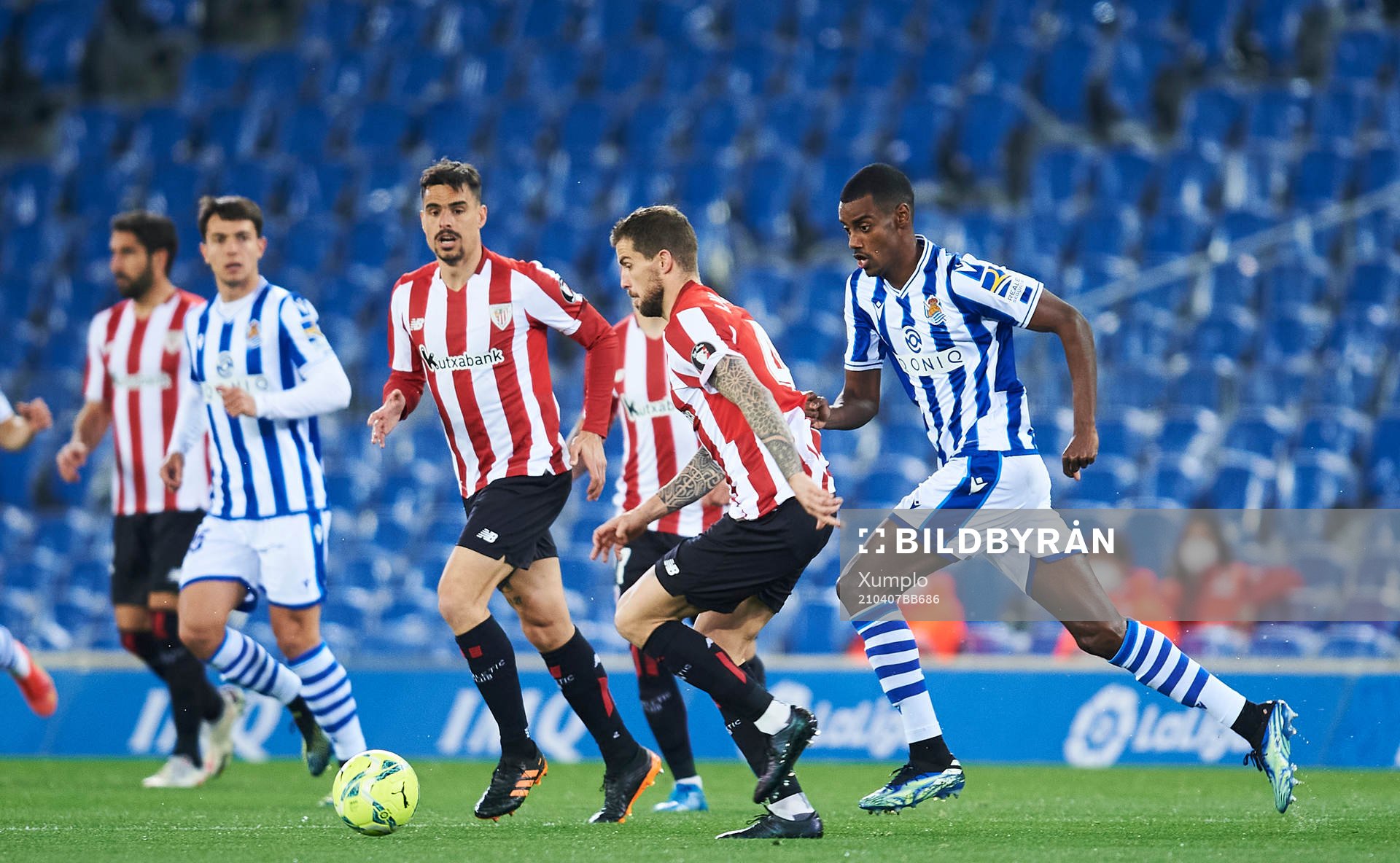 Alexander Isak of Real Sociedad duels for the ball with