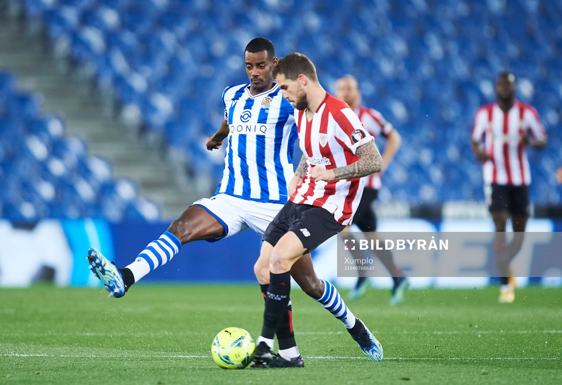 Alexander Isak of Real Sociedad duels for the ball with