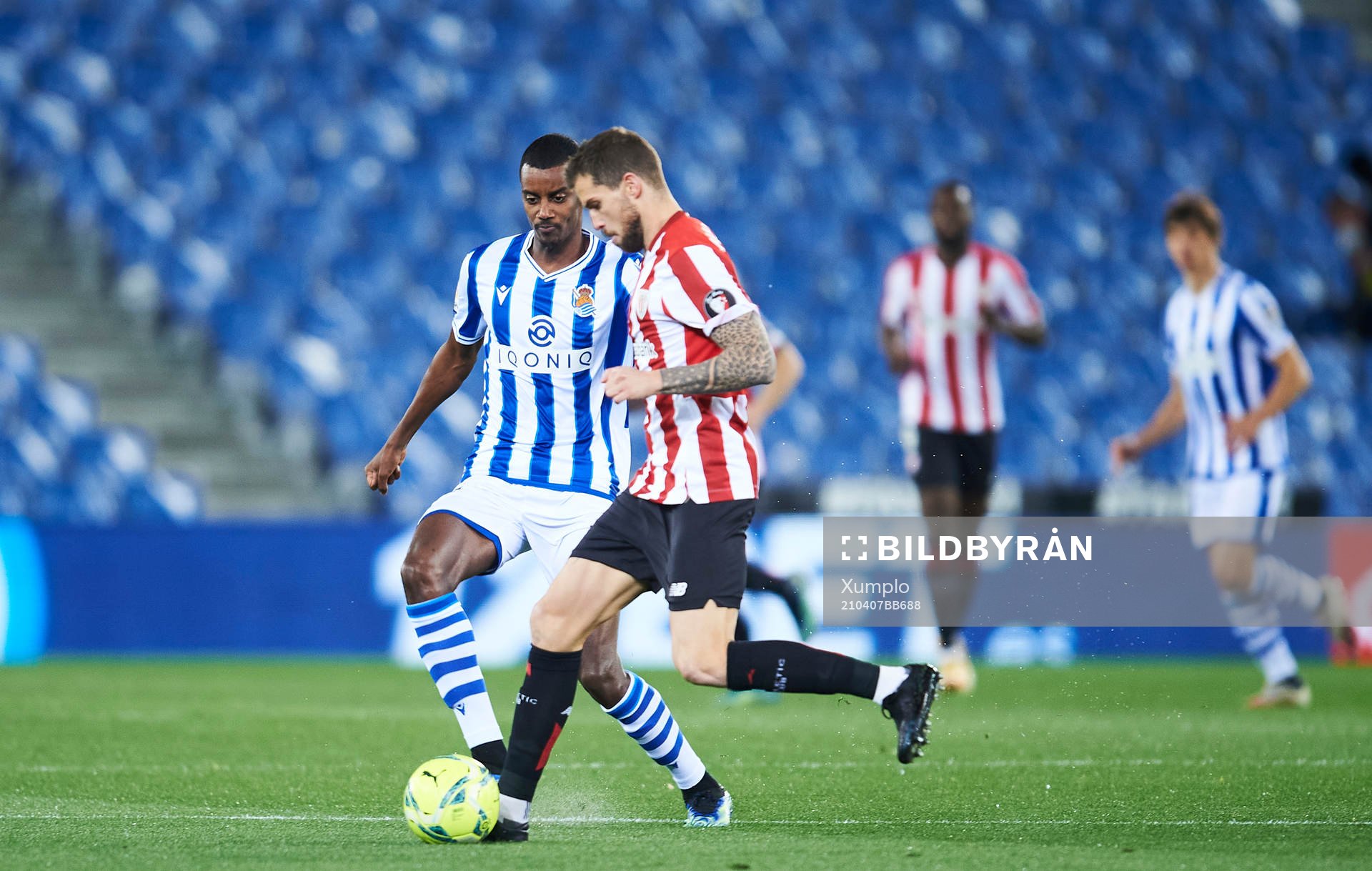 Alexander Isak of Real Sociedad duels for the ball with