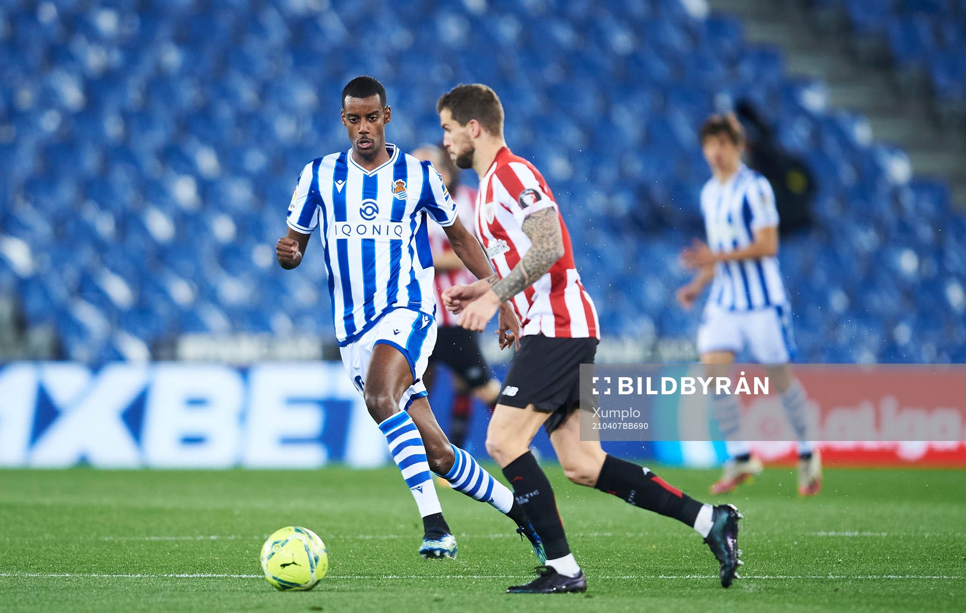 Alexander Isak of Real Sociedad duels for the ball with
