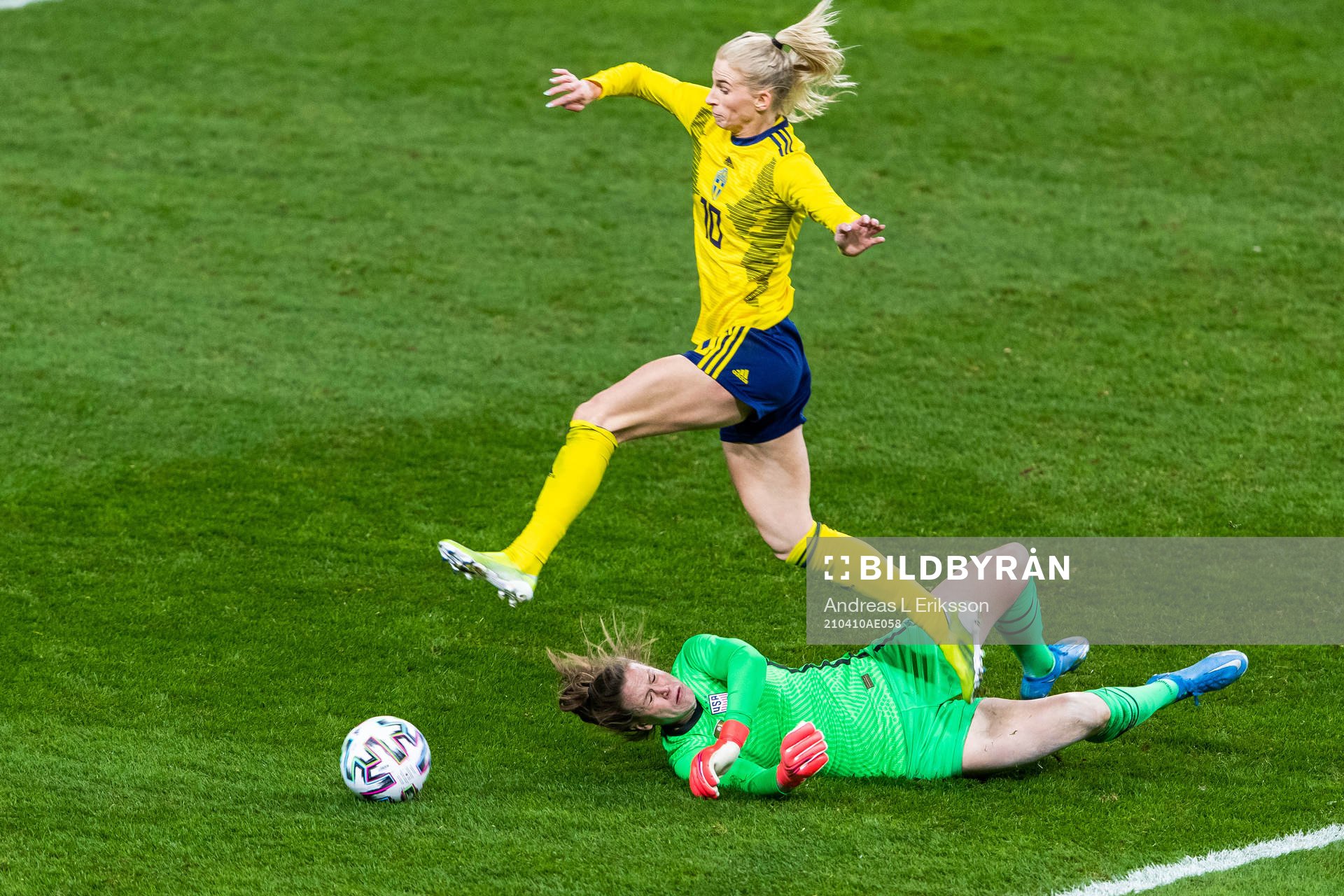 Sofia Jakobsson of Sweden jumps over goalkeeper Alyssa