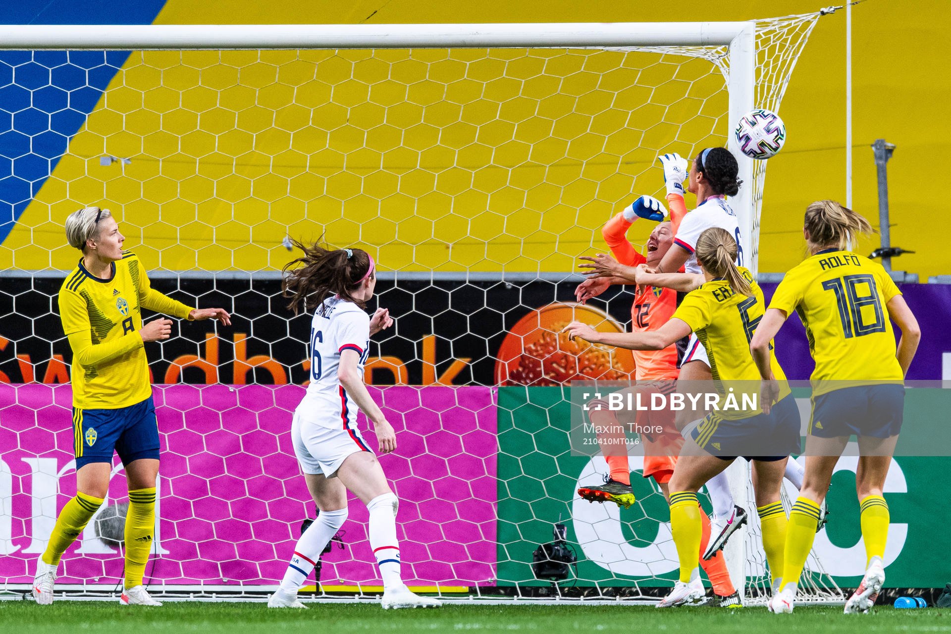 Goalkeeper Jennifer Falk of Sweden and Lynn Williams of USA