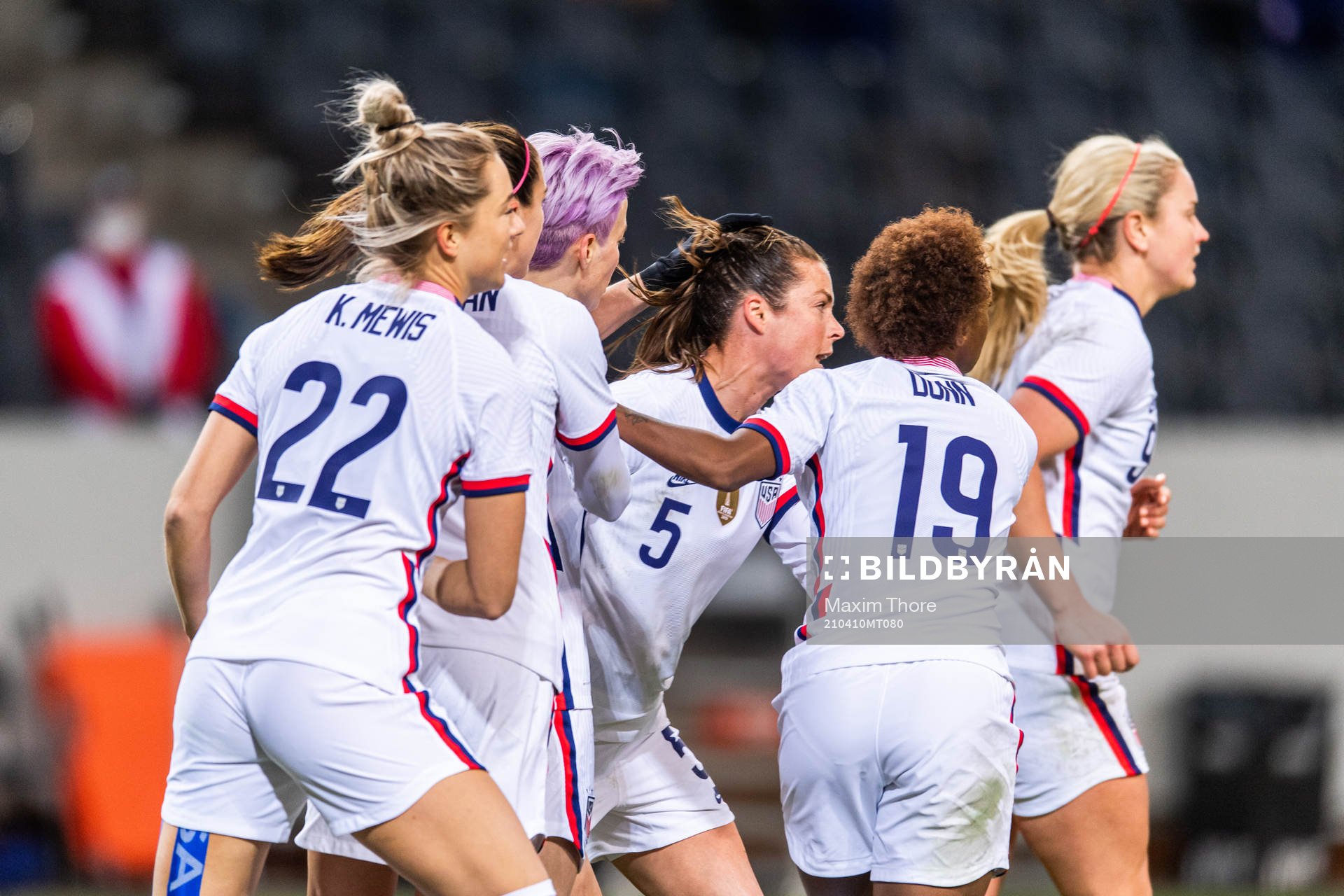 Megan Rapinoe of USA celebrates with team mates