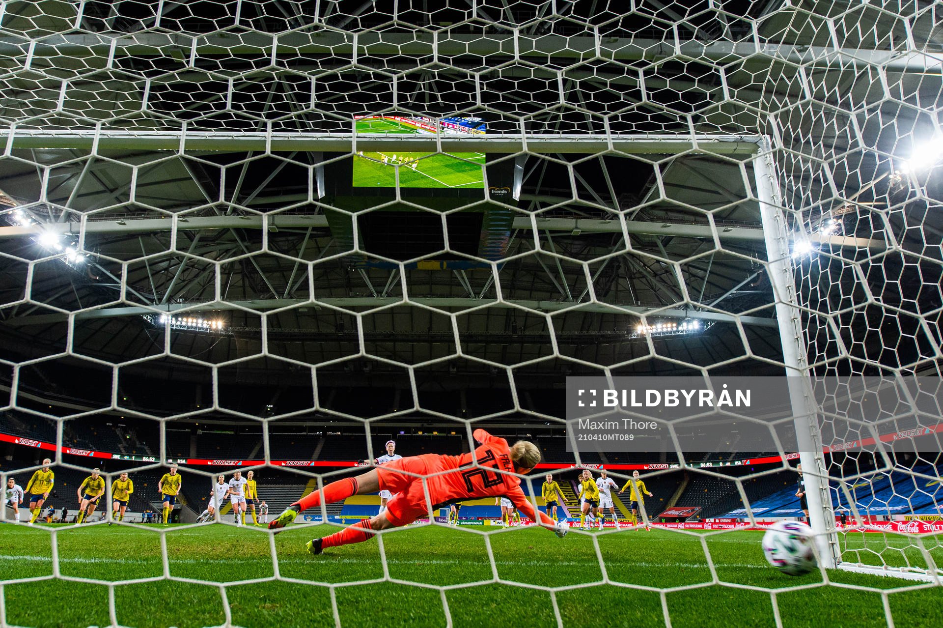 Megan Rapinoe of USA scores 1-1 behind goalkeeper Jennifer