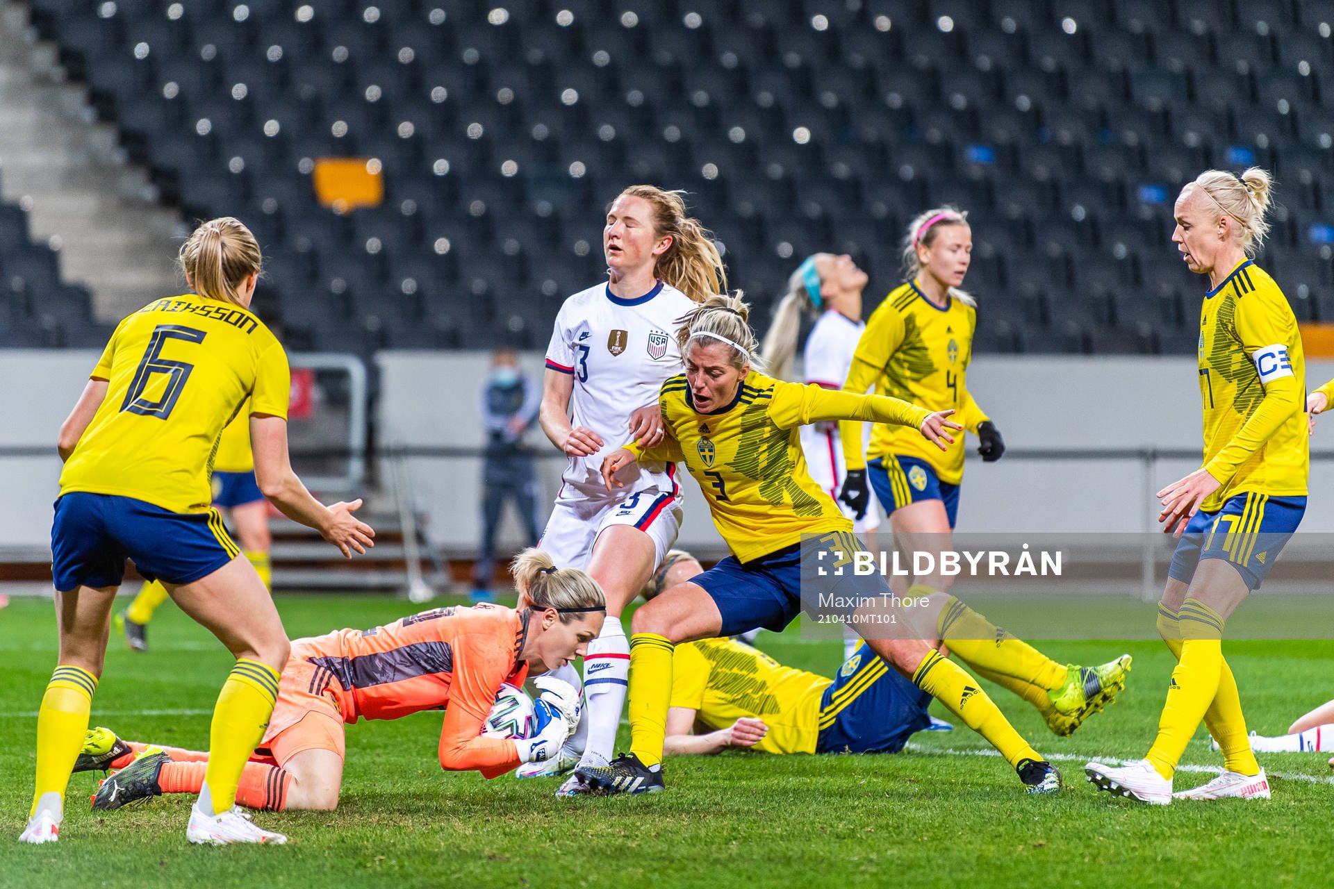 Goalkeeper Jennifer Falk of Sweden denies a goal for Samantha Mewis of USA during the women's international friendly football match between Sweden and USA on April 10, 2021 in Stockholm.
